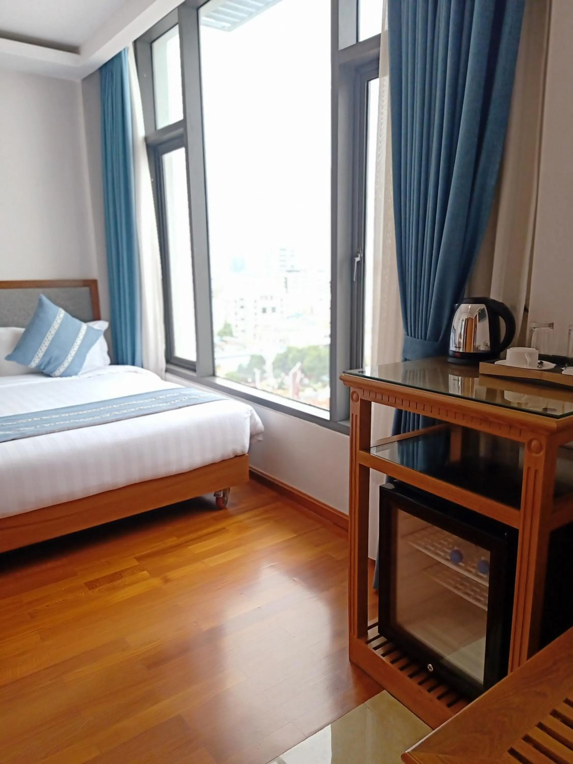 Bed in Dragon Phoenix Hotel