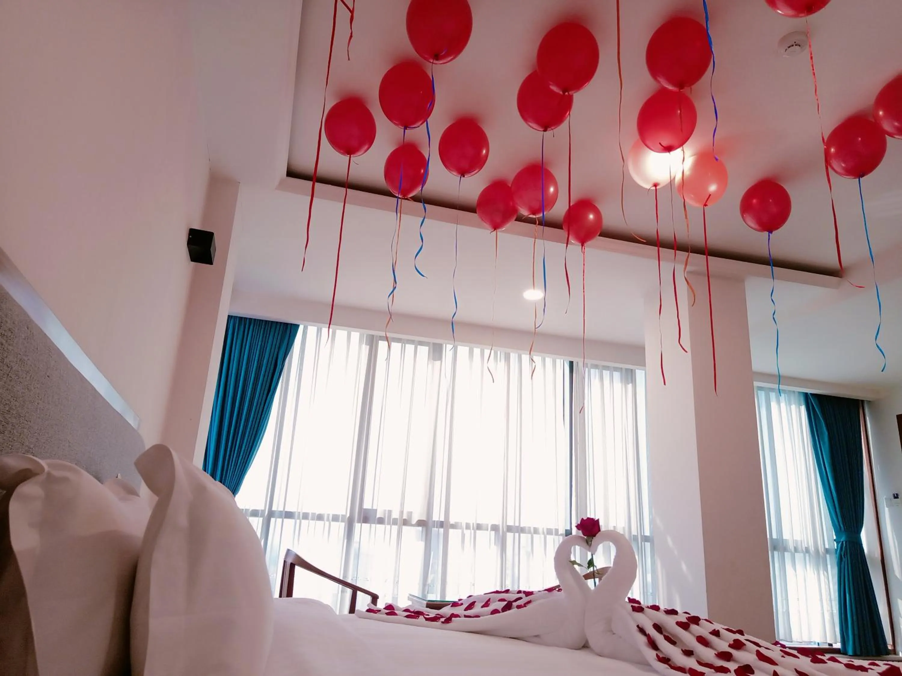 Bed in Dragon Phoenix Hotel