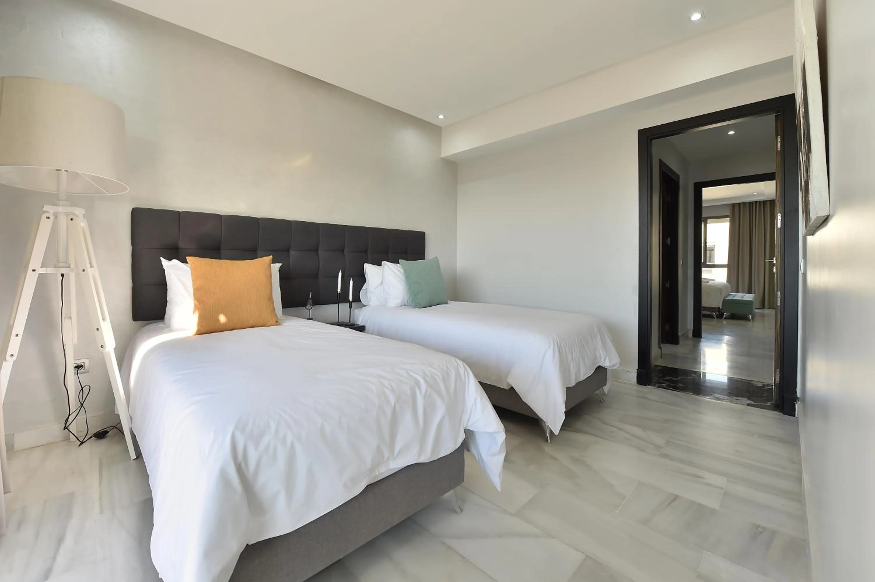 Bed in Le Yacht Suites Hotel