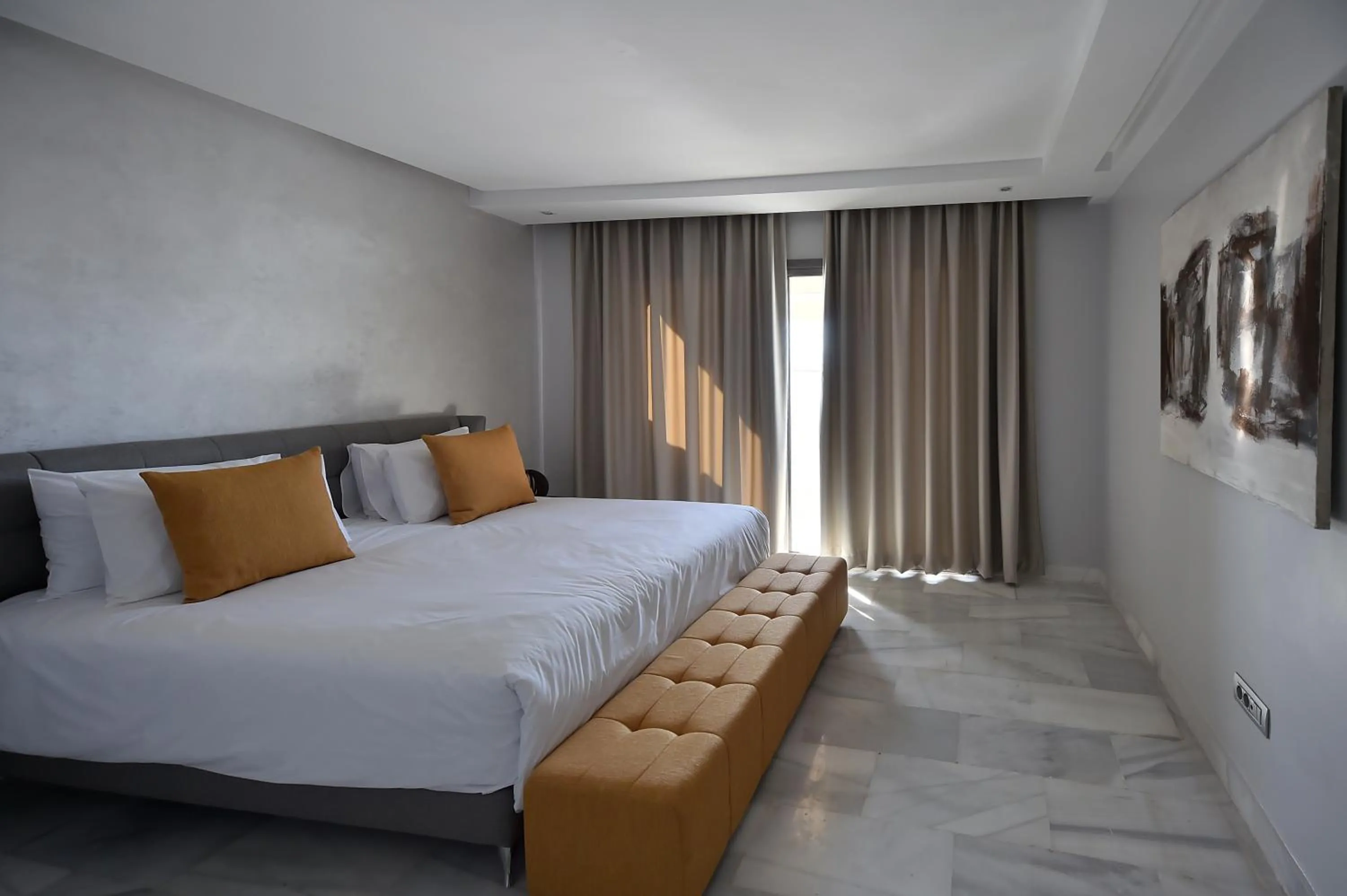 Bed in Le Yacht Suites Hotel