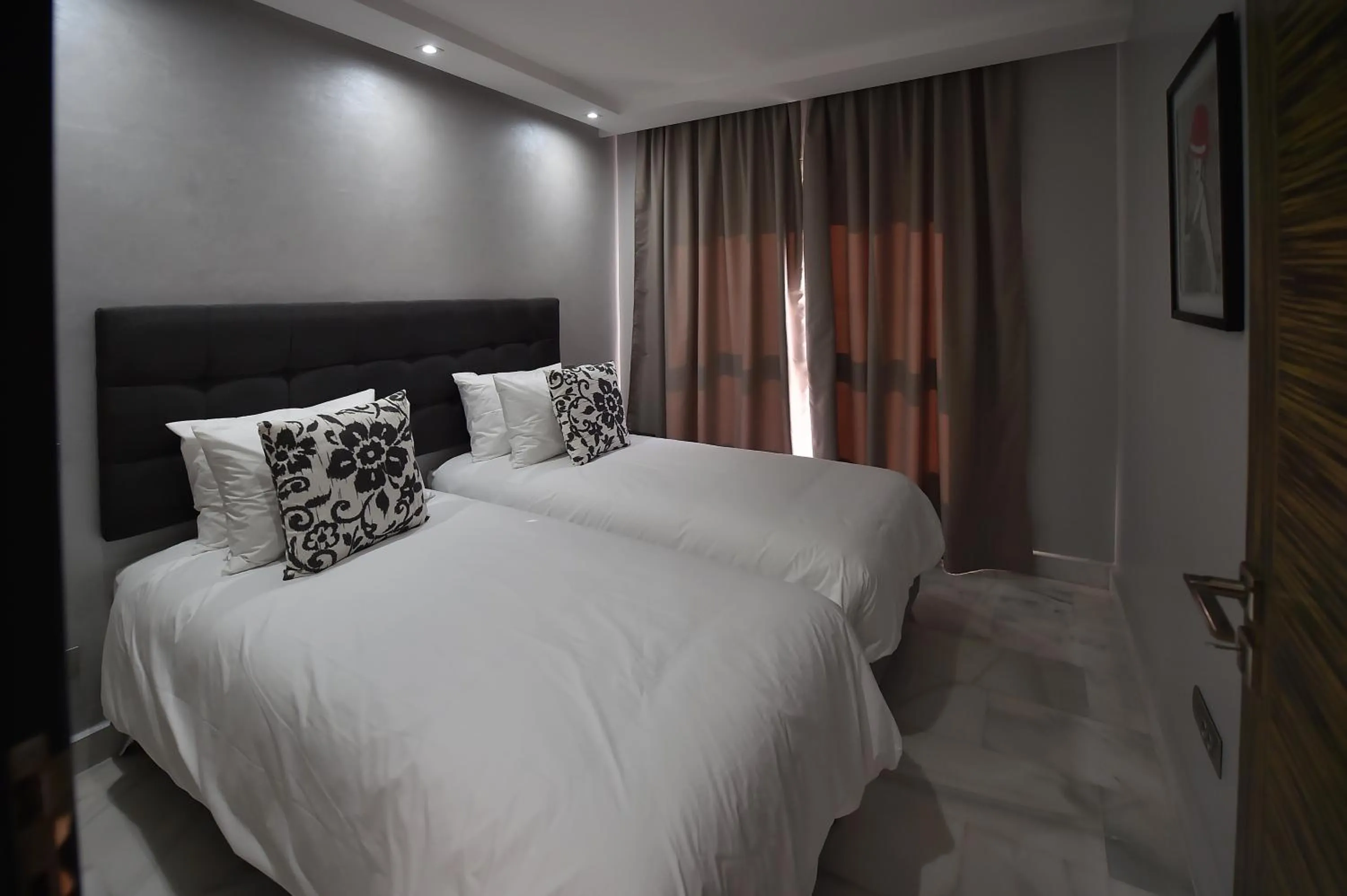 Bed in Le Yacht Suites Hotel