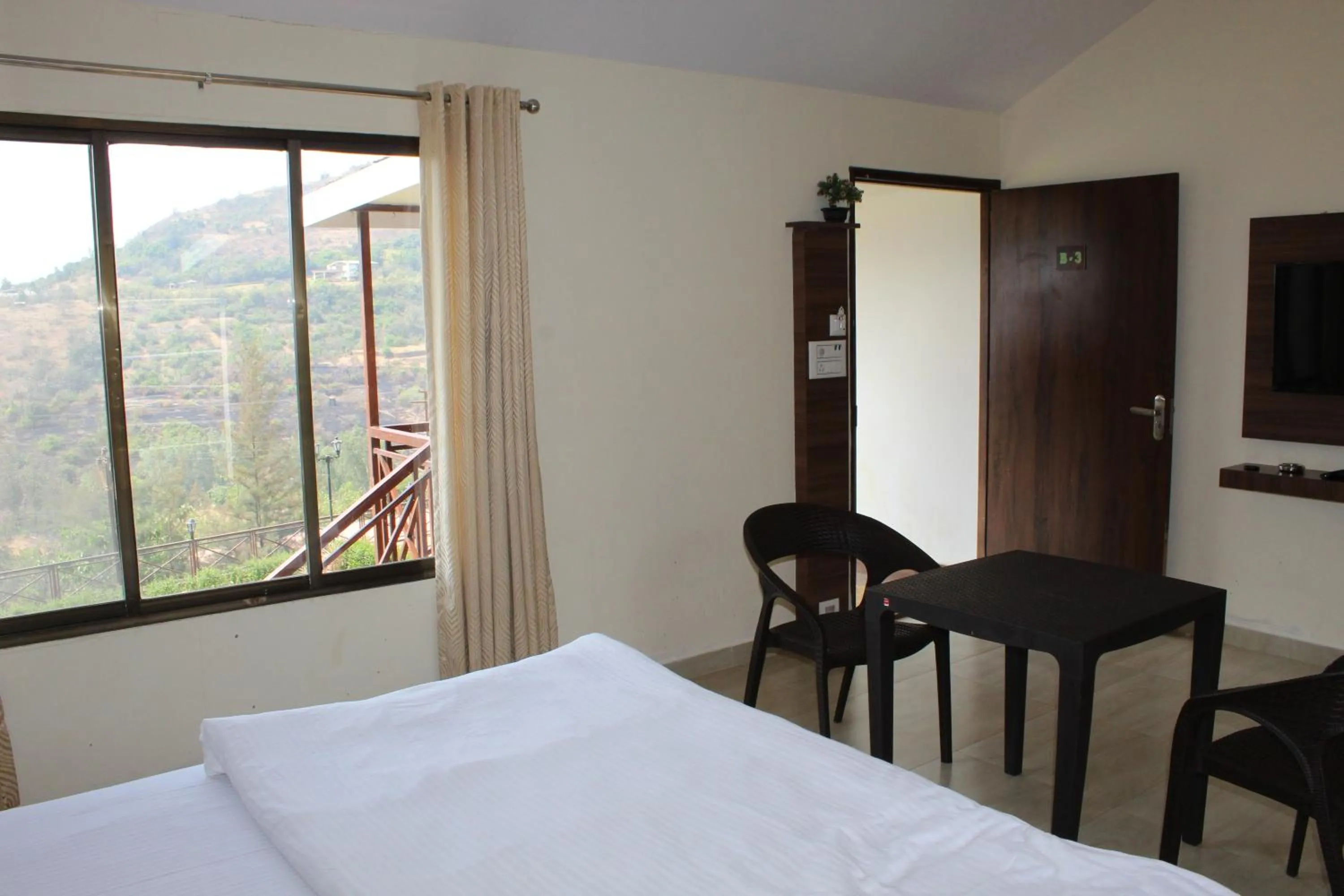 Photo of the whole room, Bed in Green Velvet Resort-Near Pawna Lake