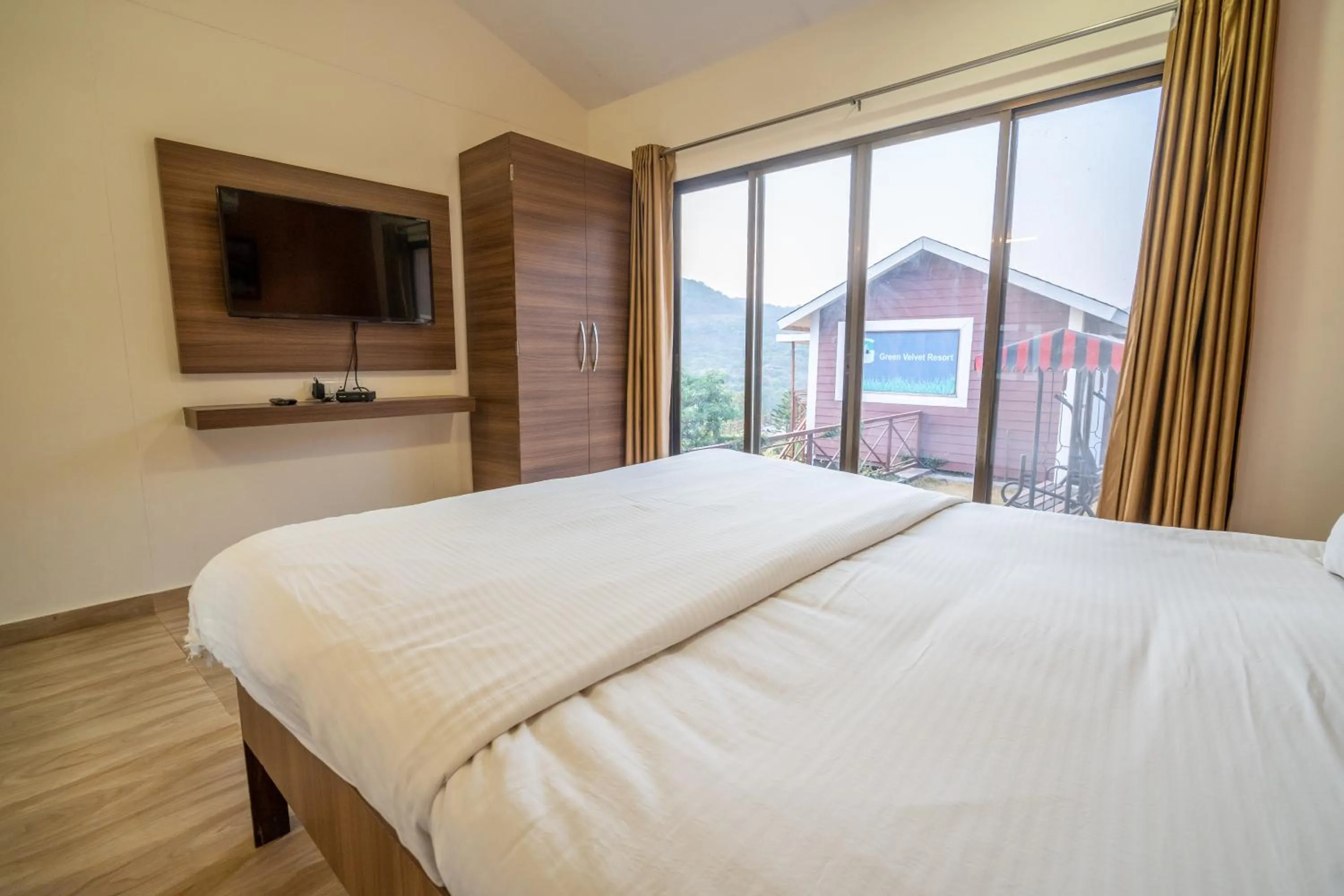 Communal lounge/ TV room, Bed in Green Velvet Resort-Near Pawna Lake