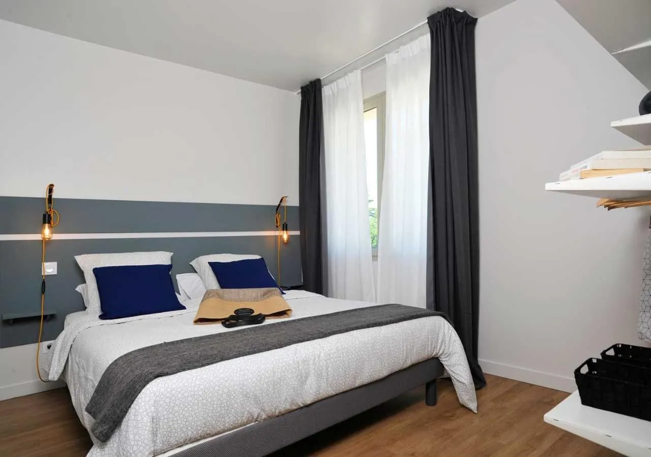 Photo of the whole room, Bed in CLOS DES THERMES A JONZAC