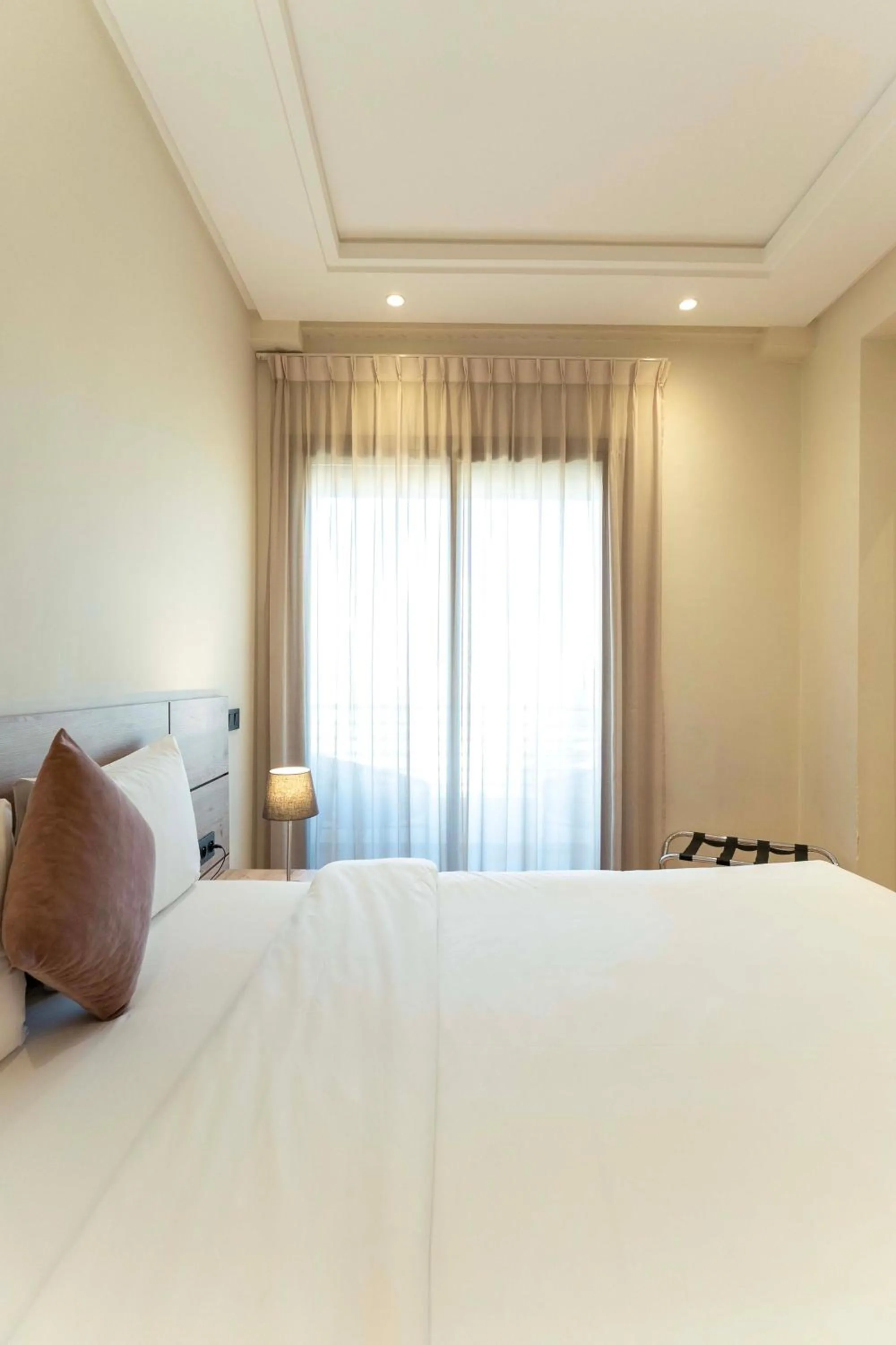 Bed in Flamant Rose Appart Hotel