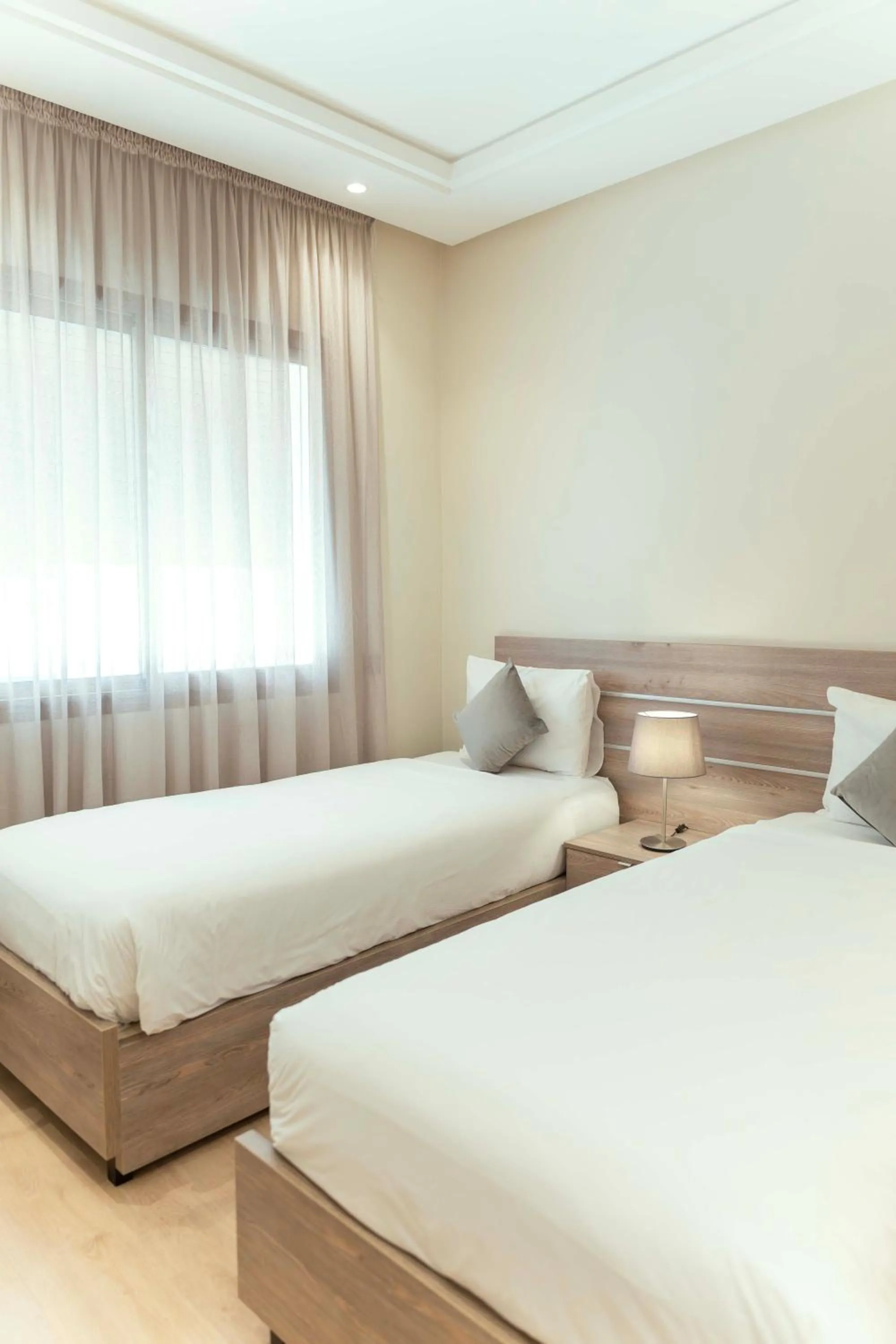 Bed in Flamant Rose Appart Hotel