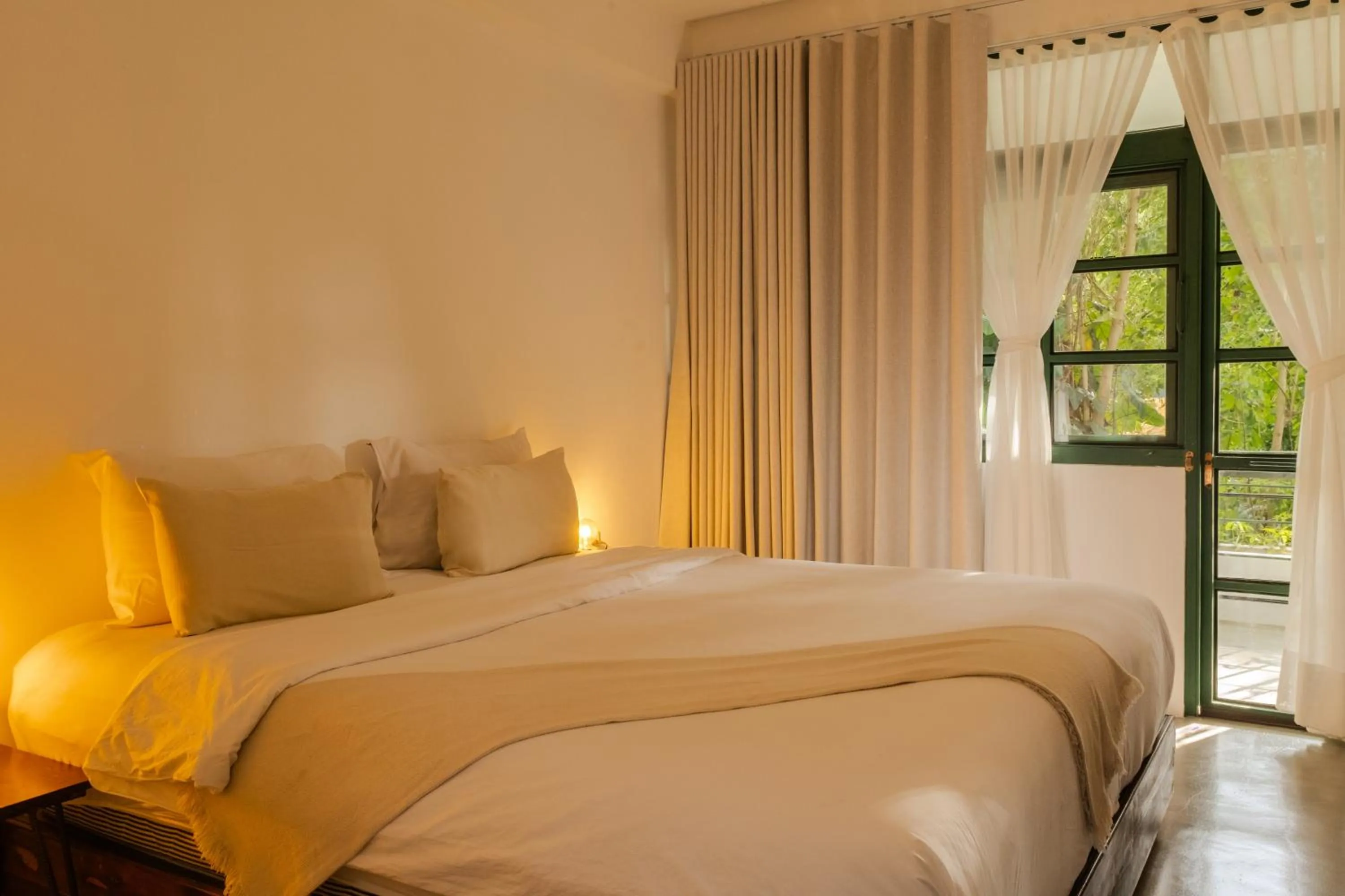 Bed in Big Tree Boutique Hotel