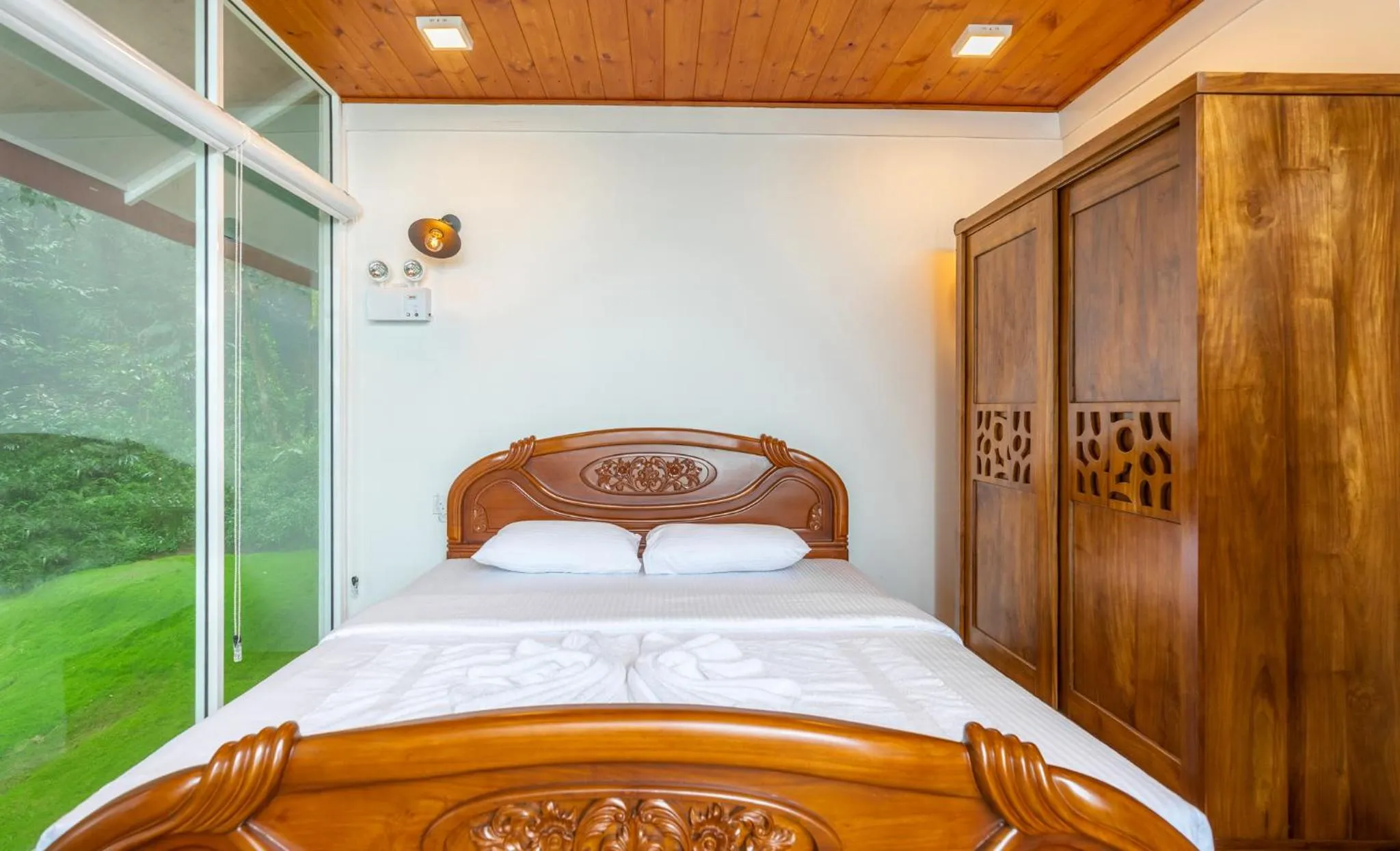 Bed in Mandaram Eco Resort