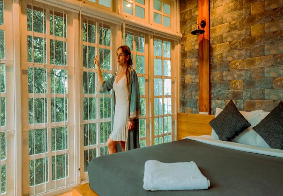 Bed in Mandaram Eco Resort