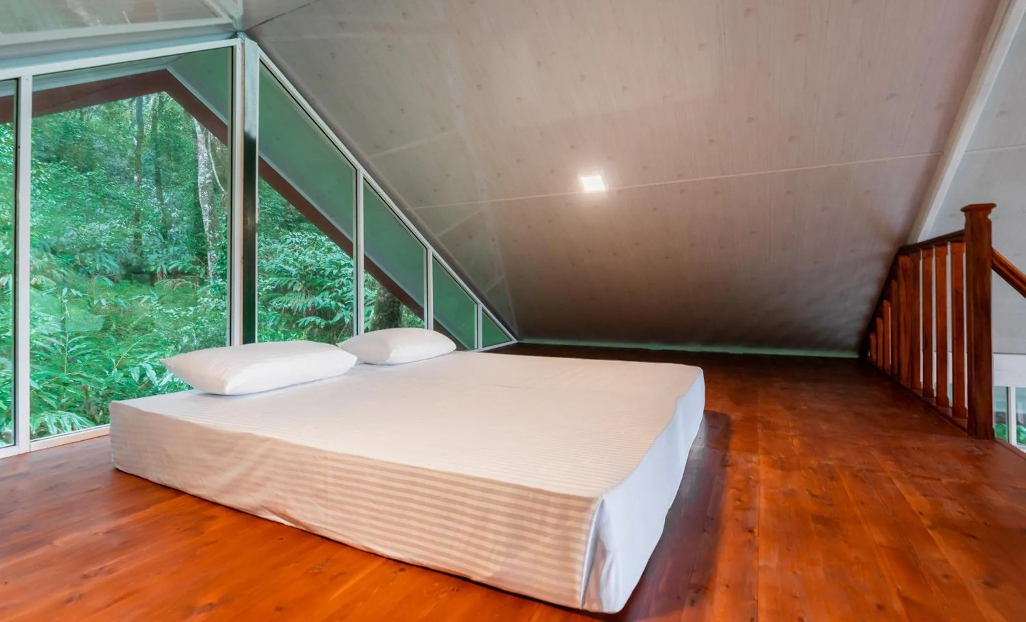 Bed in Mandaram Eco Resort