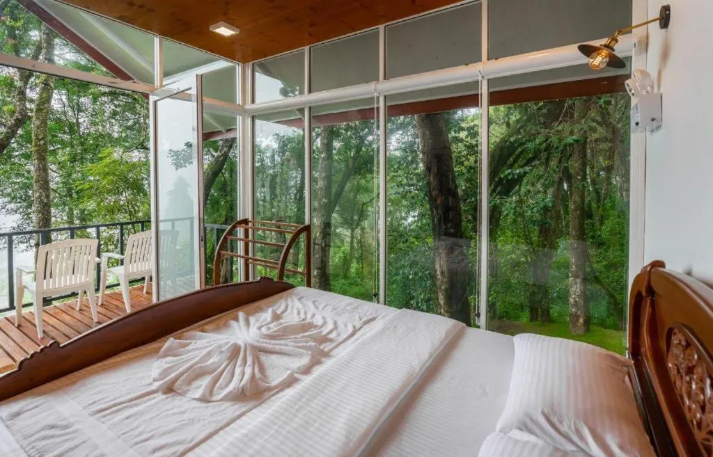 Bed in Mandaram Eco Resort