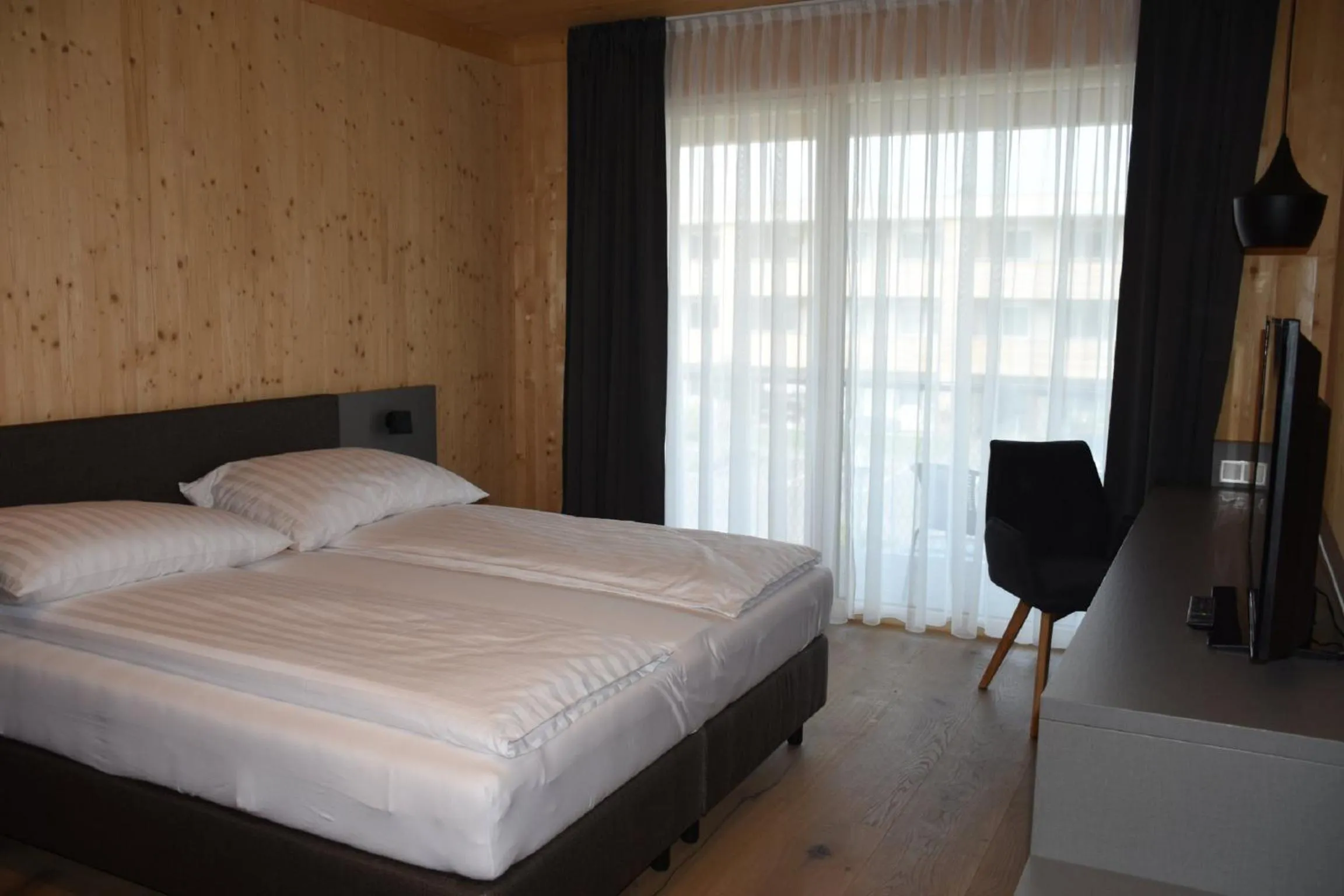 Bed in GästeHAUS & HOFladen Familie Öllerer