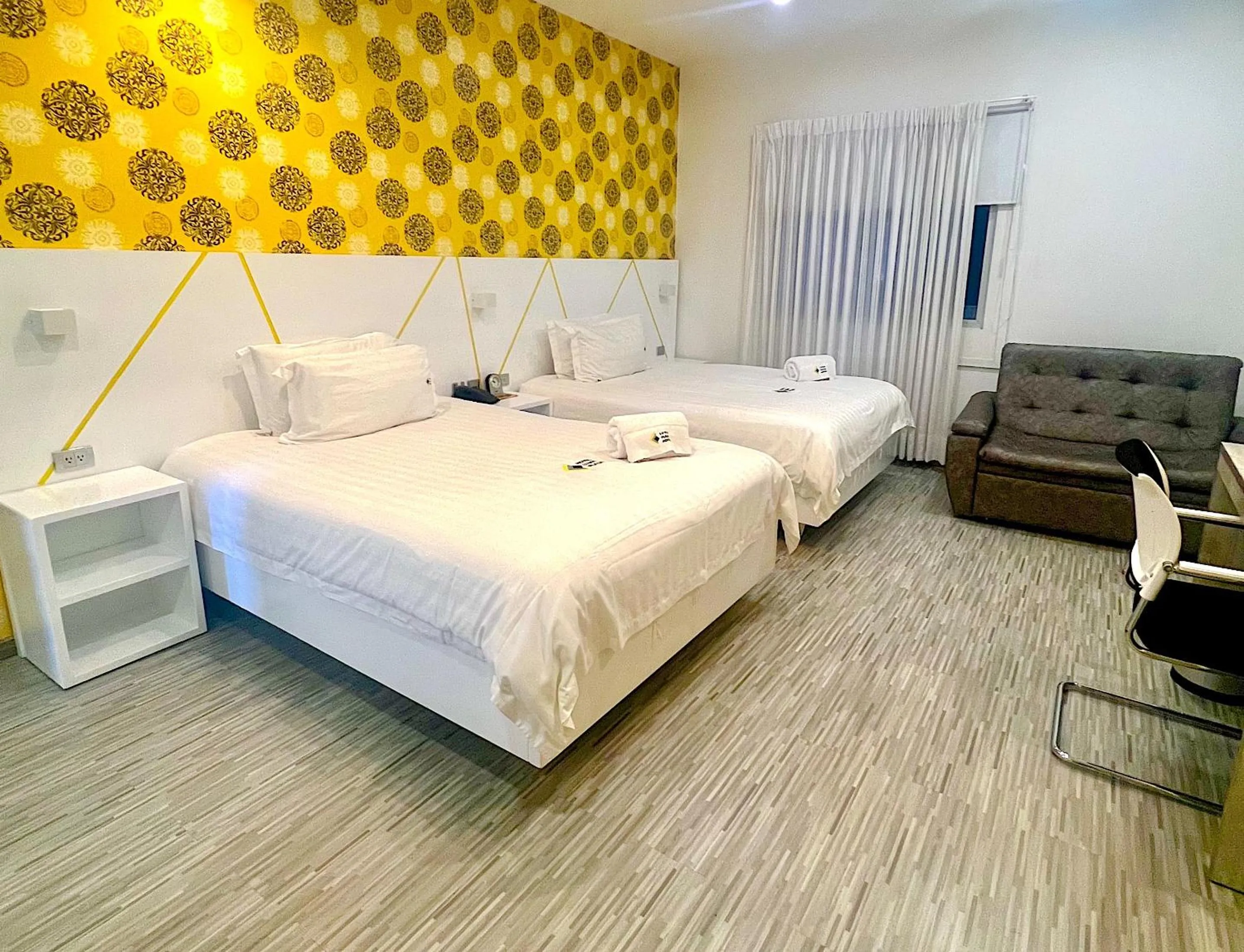 Bed in Luma Plaza Hotel