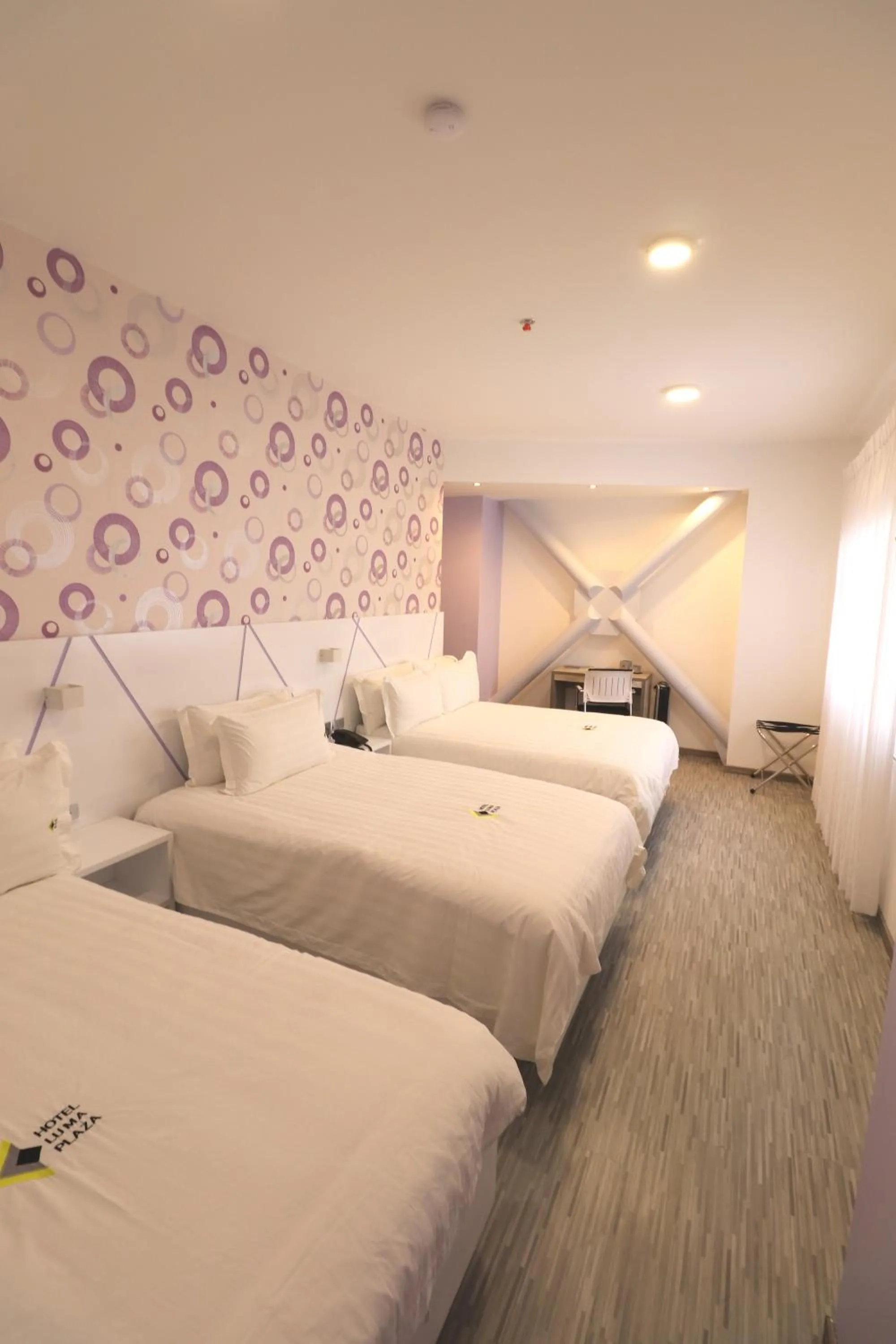 Bed in Luma Plaza Hotel