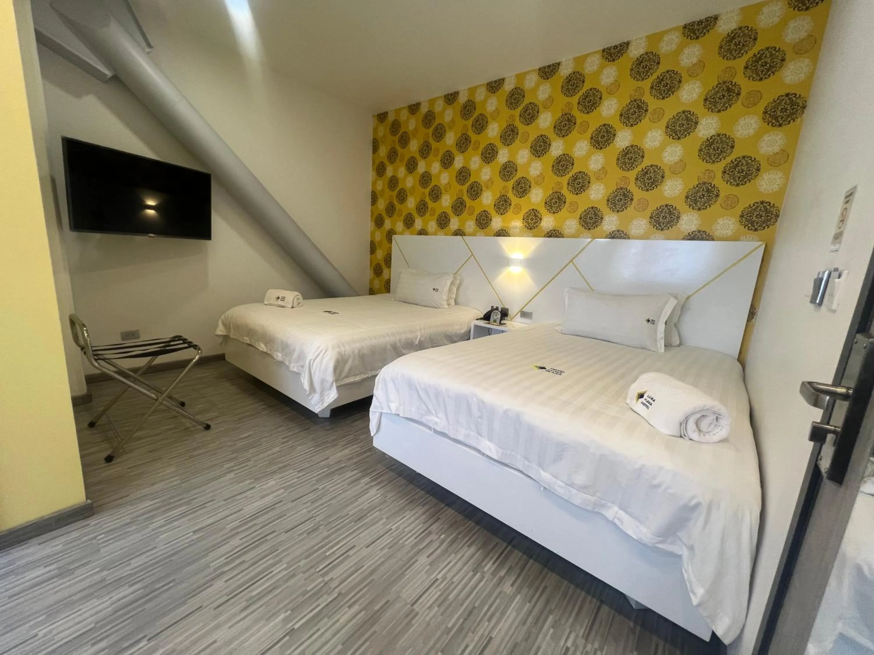 Photo of the whole room, Bed in Luma Plaza Hotel