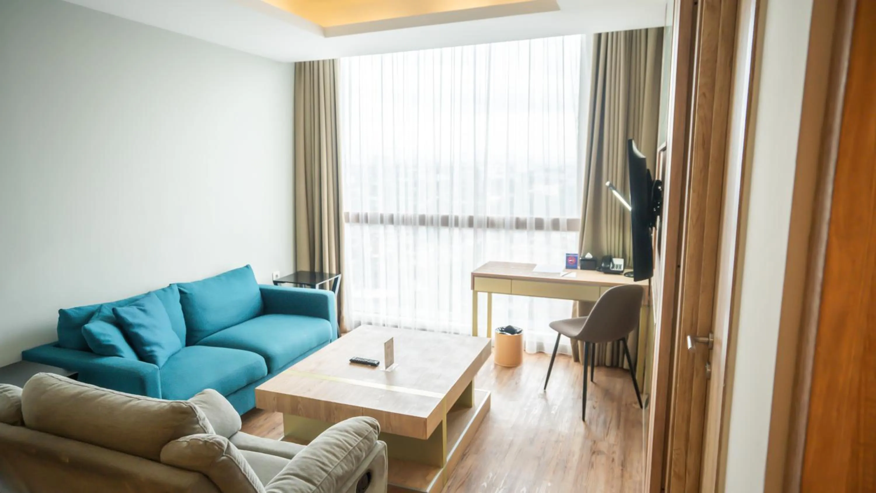 Living room in Bigland Bogor Hotel Powered by Archipelago