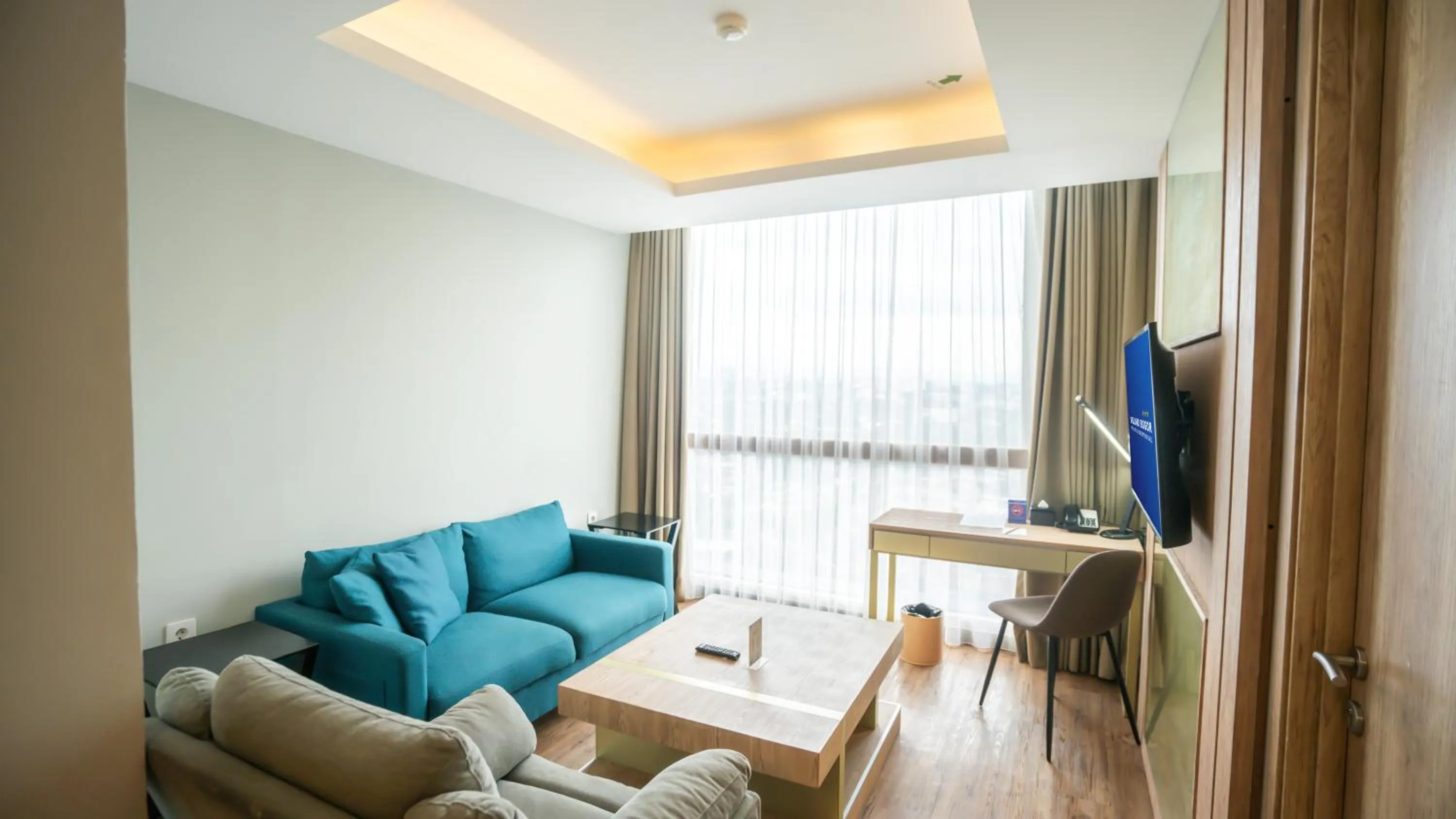 Living room in Bigland Bogor Hotel Powered by Archipelago