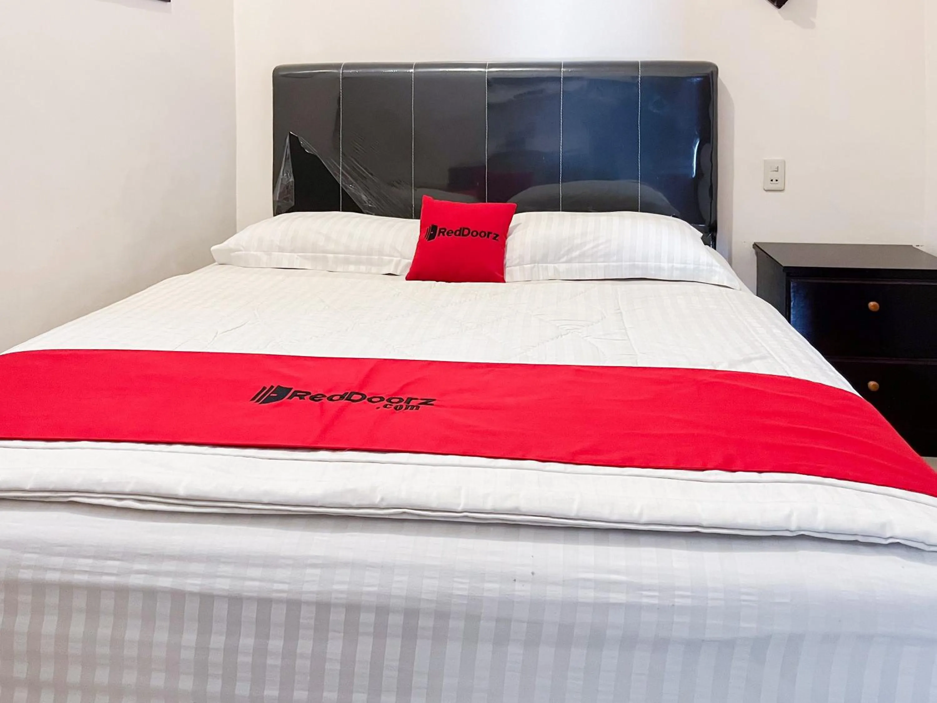 Bed in OYO 1500 Mh Homestay