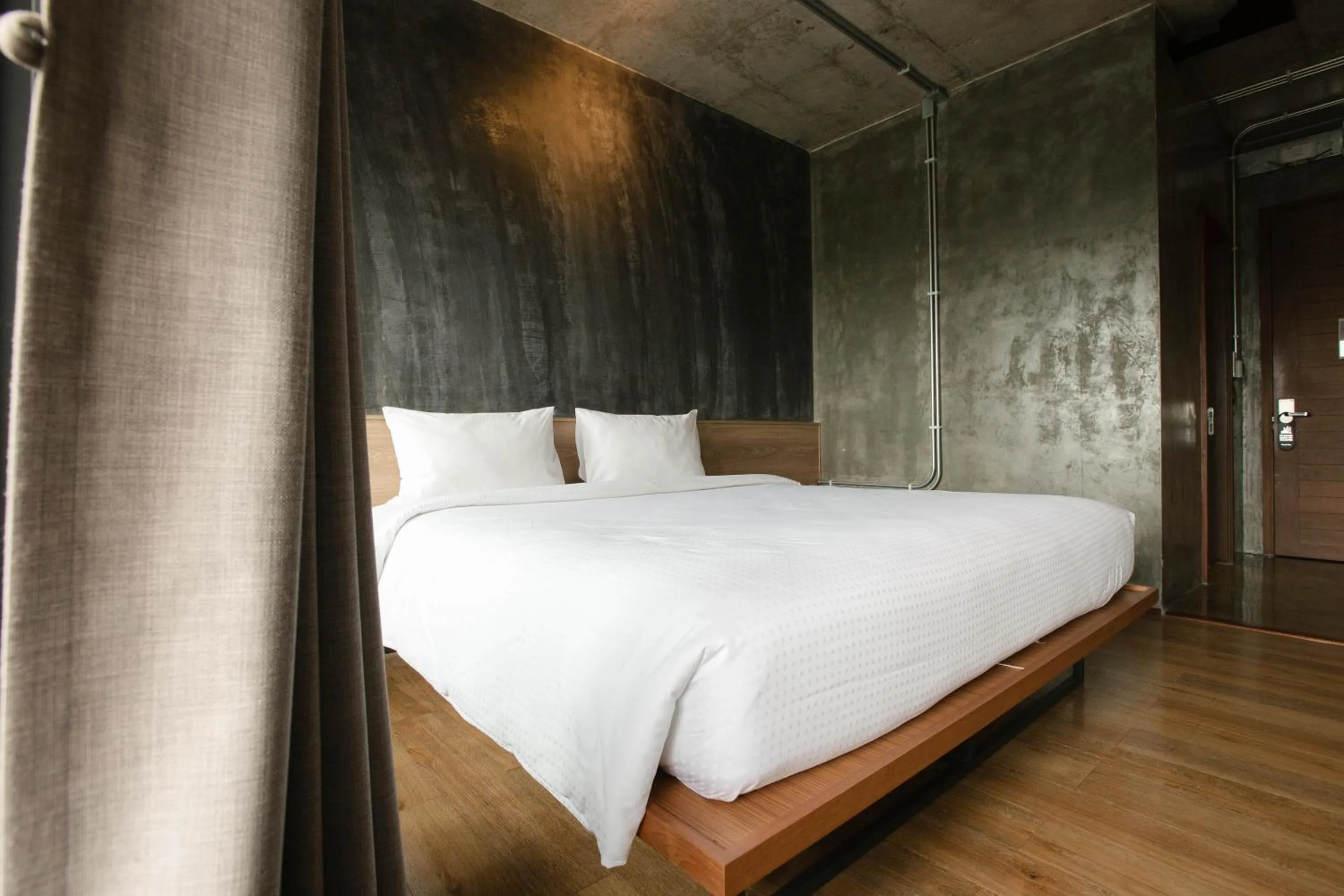 Bed in Navakitel Design Hotel