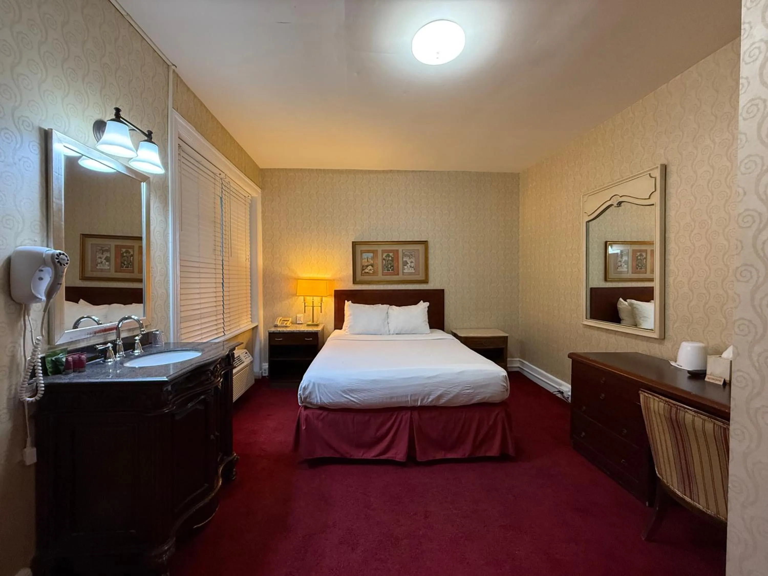 Bed in Windsor Inn Hotel