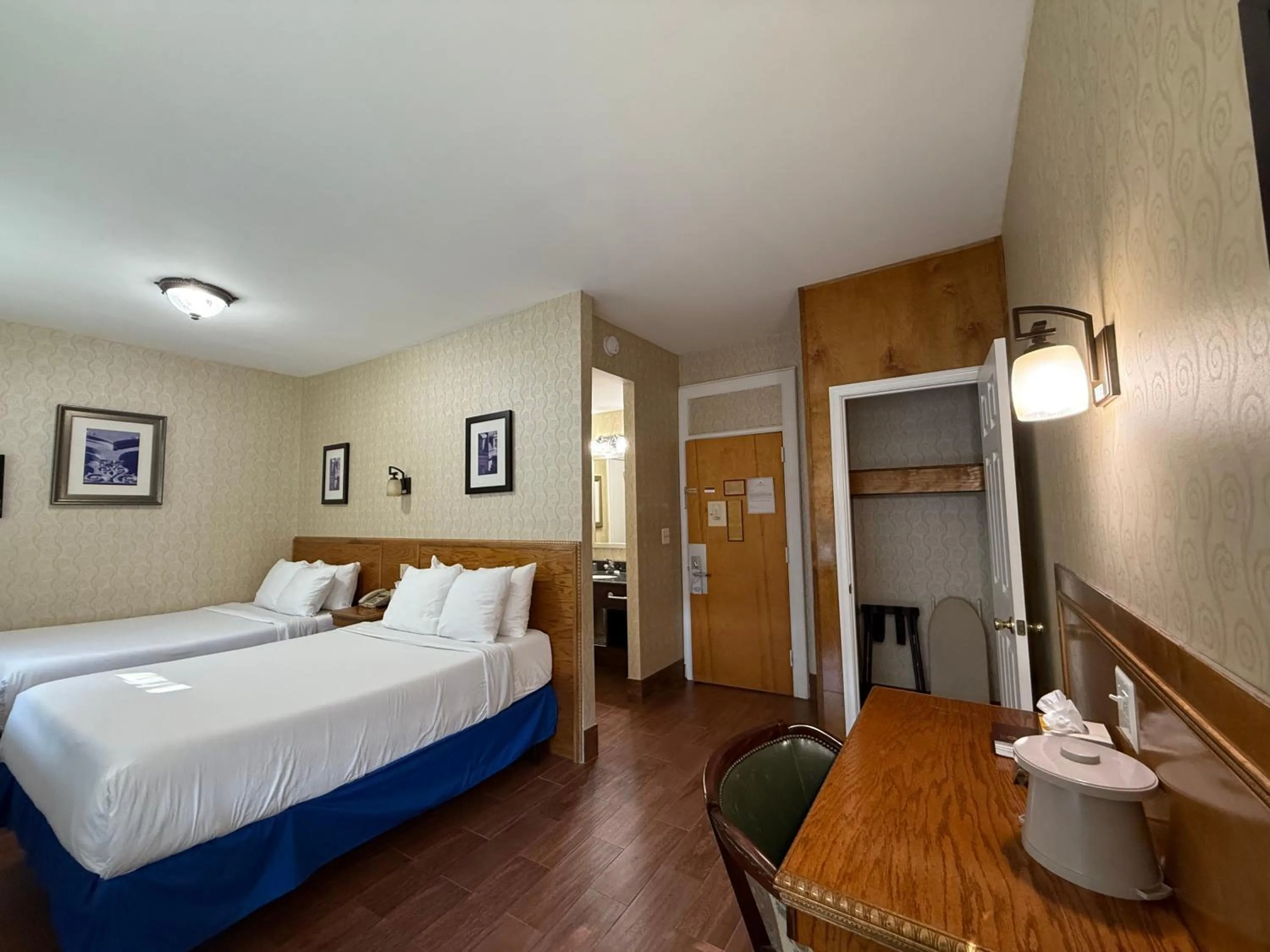 Bed in Windsor Inn Hotel