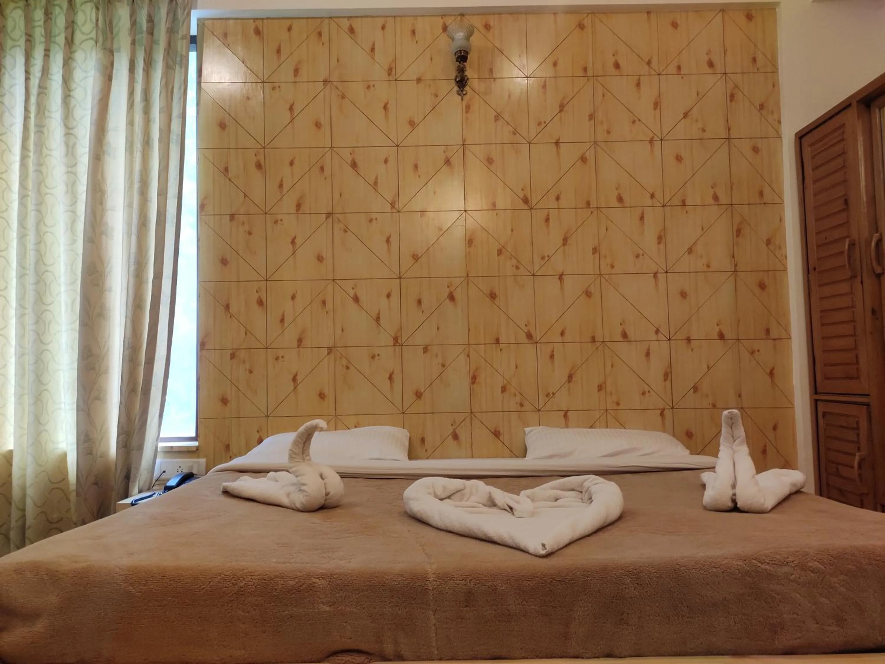 Bedroom, Bed in Greenwoods Inn Mcleodganj #Parking #lift #All Balcony Rooms #Rooftop Terrace #Prime Location # Close to the Triund Trek Point 400 Mtr Head