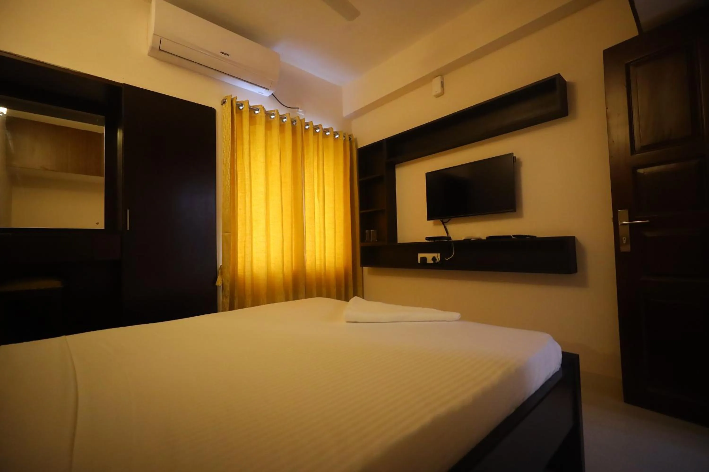 Bed in Kfour Apartment & Hotels Private Limited