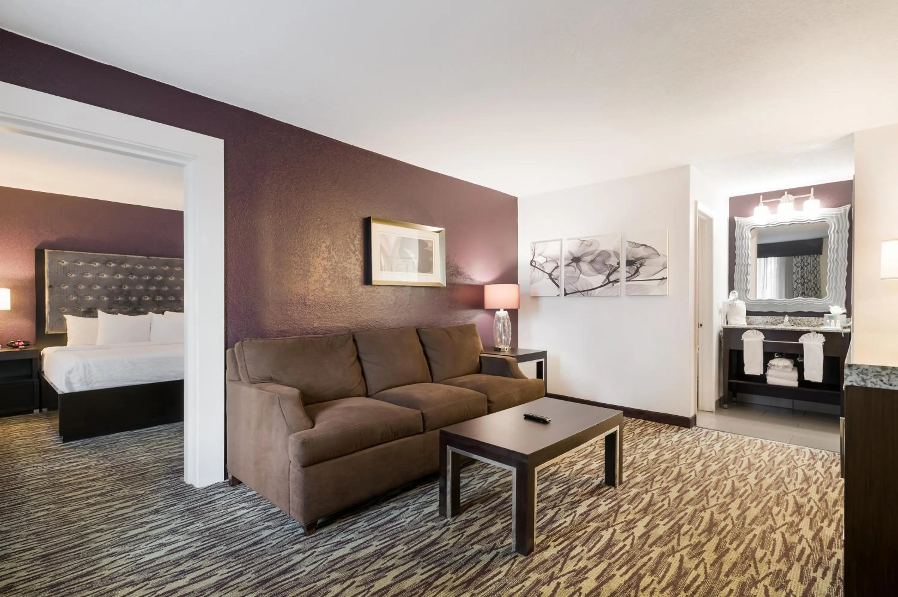 Living room, Bed in Clarion Inn & Suites Across From Universal Orlando Resort