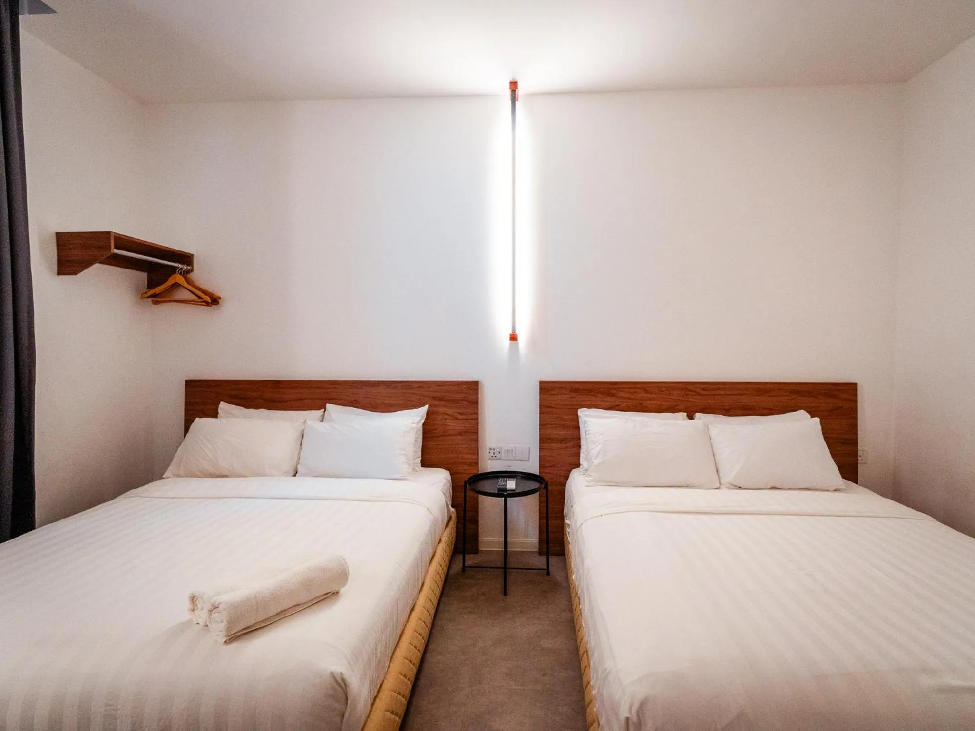 Bed in T+ PREMIUM HOTEL