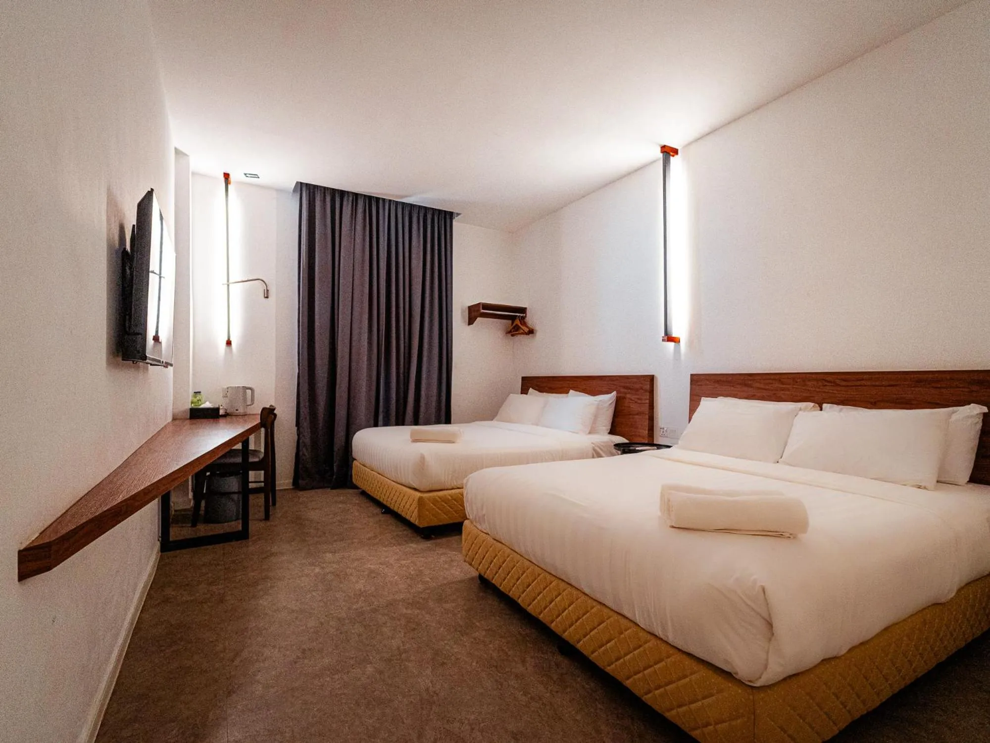 Bed in T+ PREMIUM HOTEL