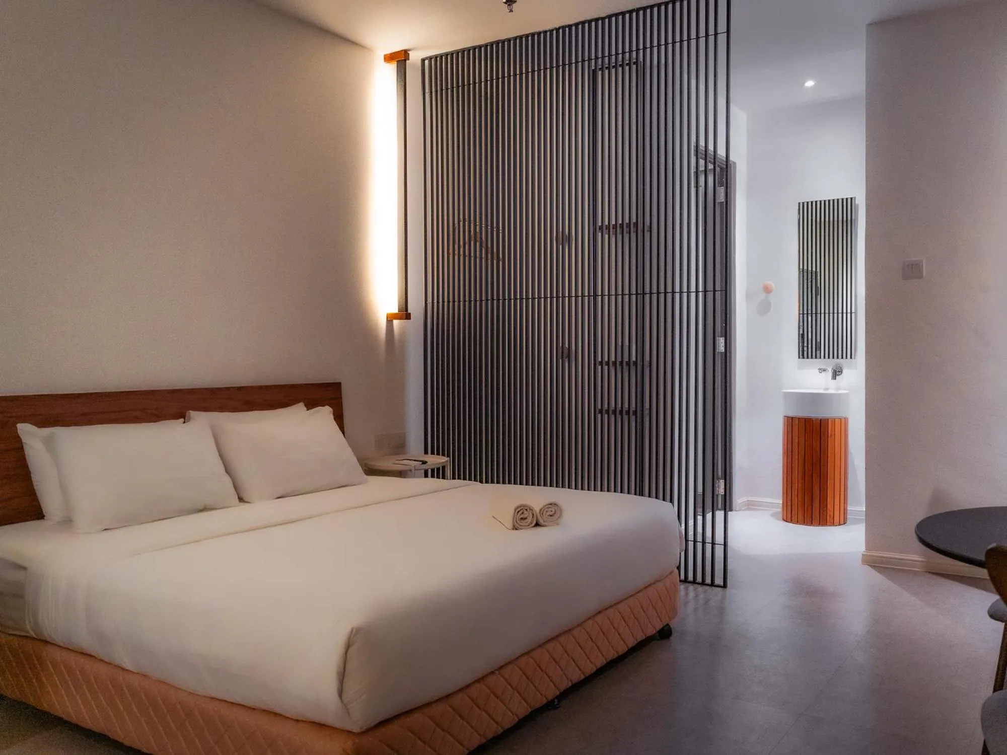 Bed in T+ PREMIUM HOTEL