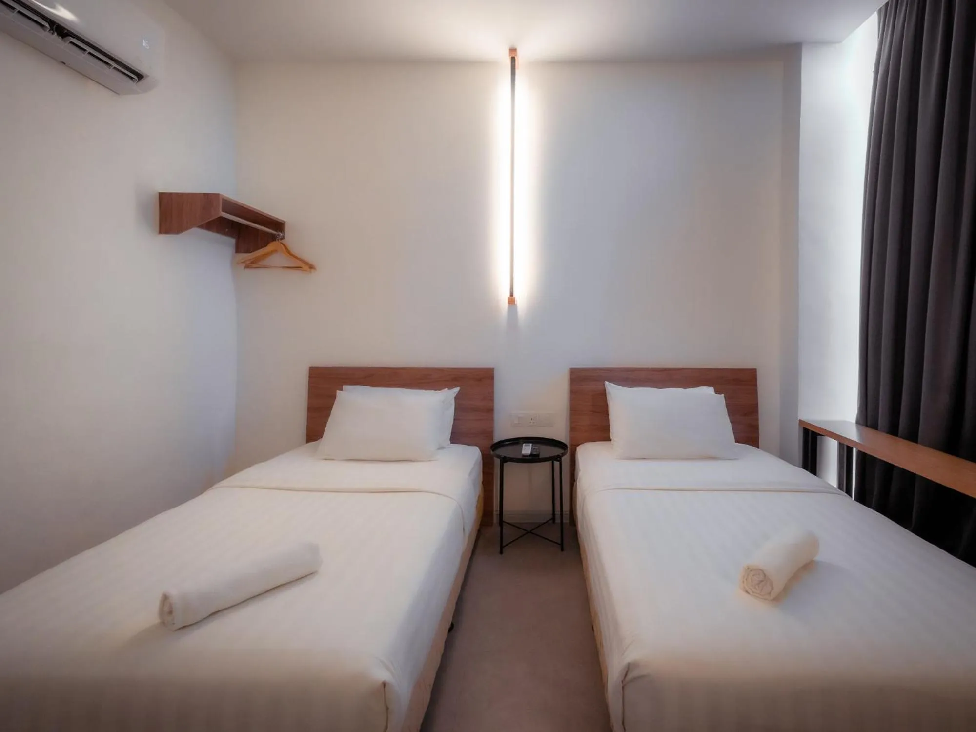 Bed in T+ PREMIUM HOTEL