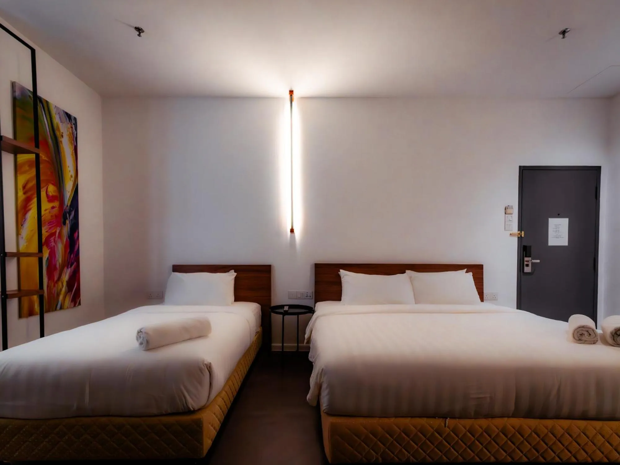 Bed in T+ PREMIUM HOTEL