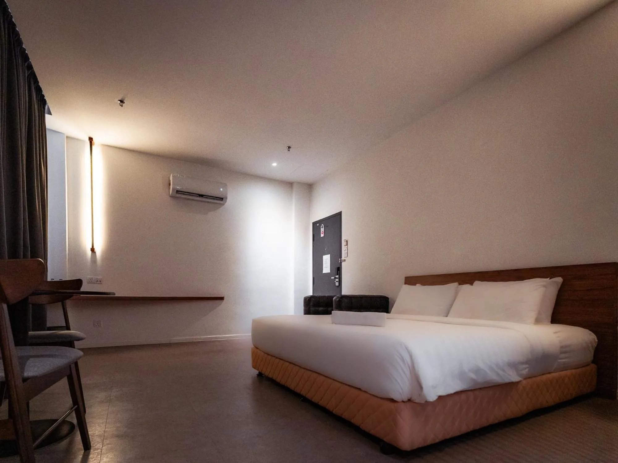 Bed in T+ PREMIUM HOTEL