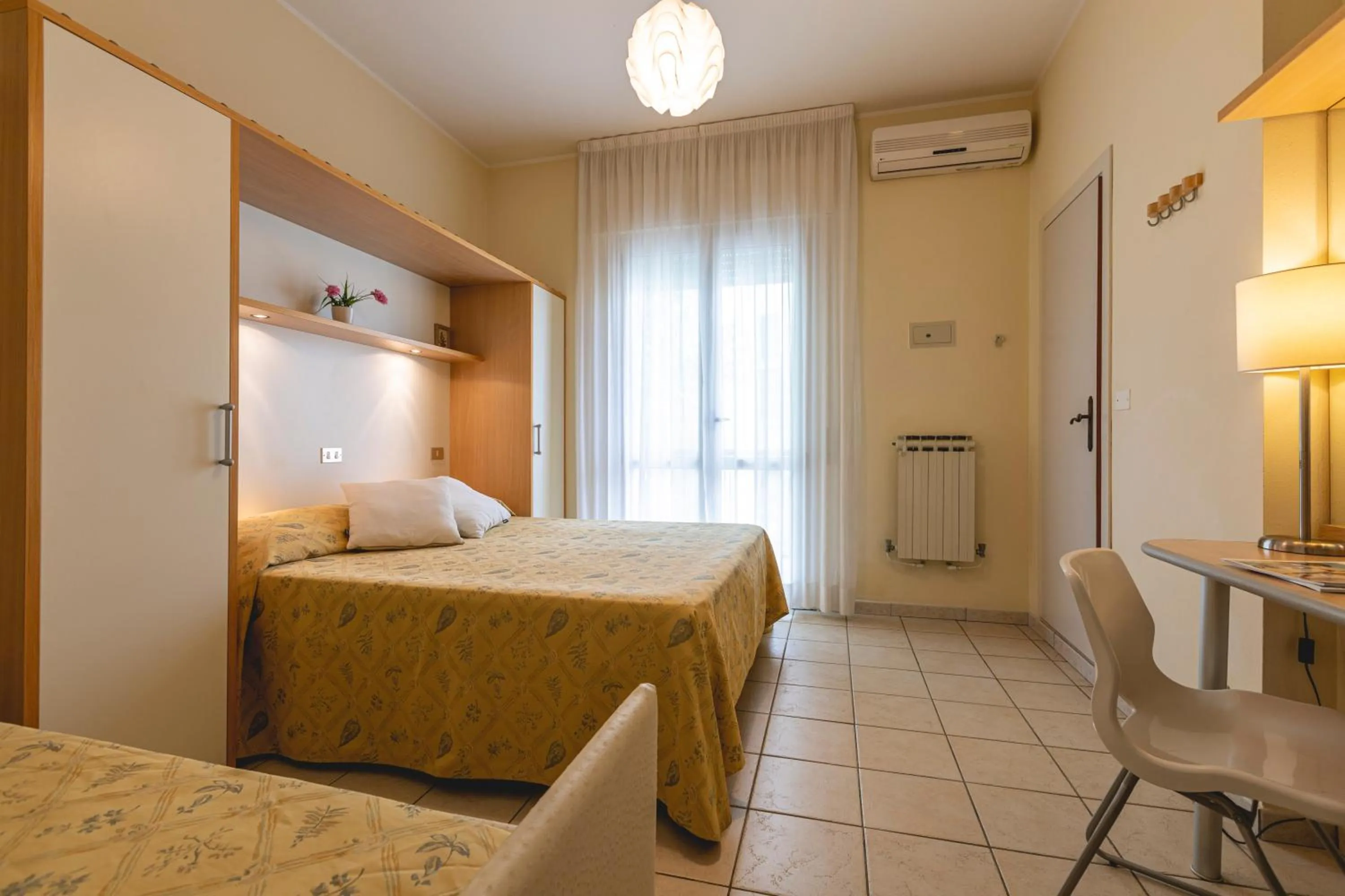 Bed in Hotel Loretta & Dependance