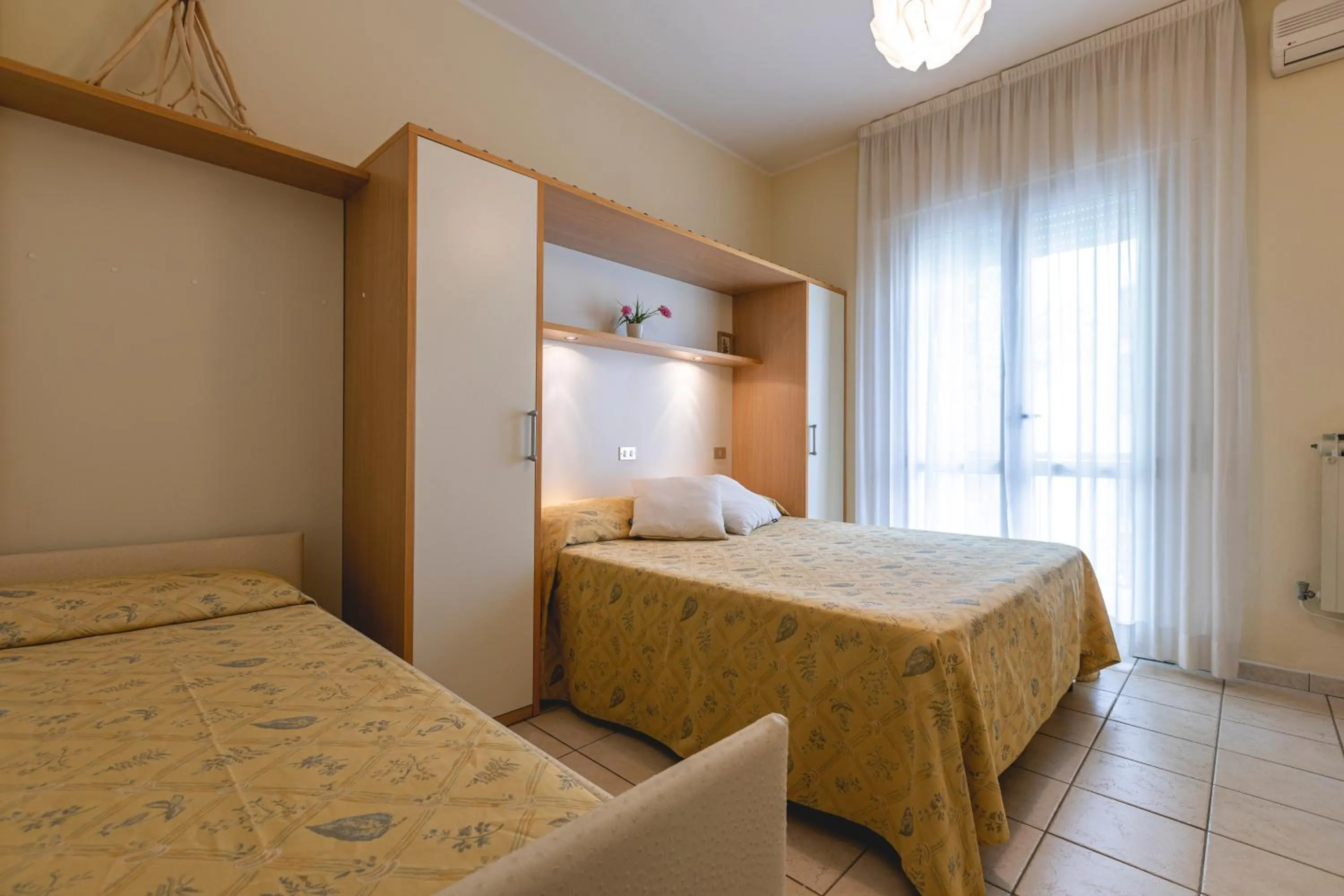 Bed in Hotel Loretta & Dependance