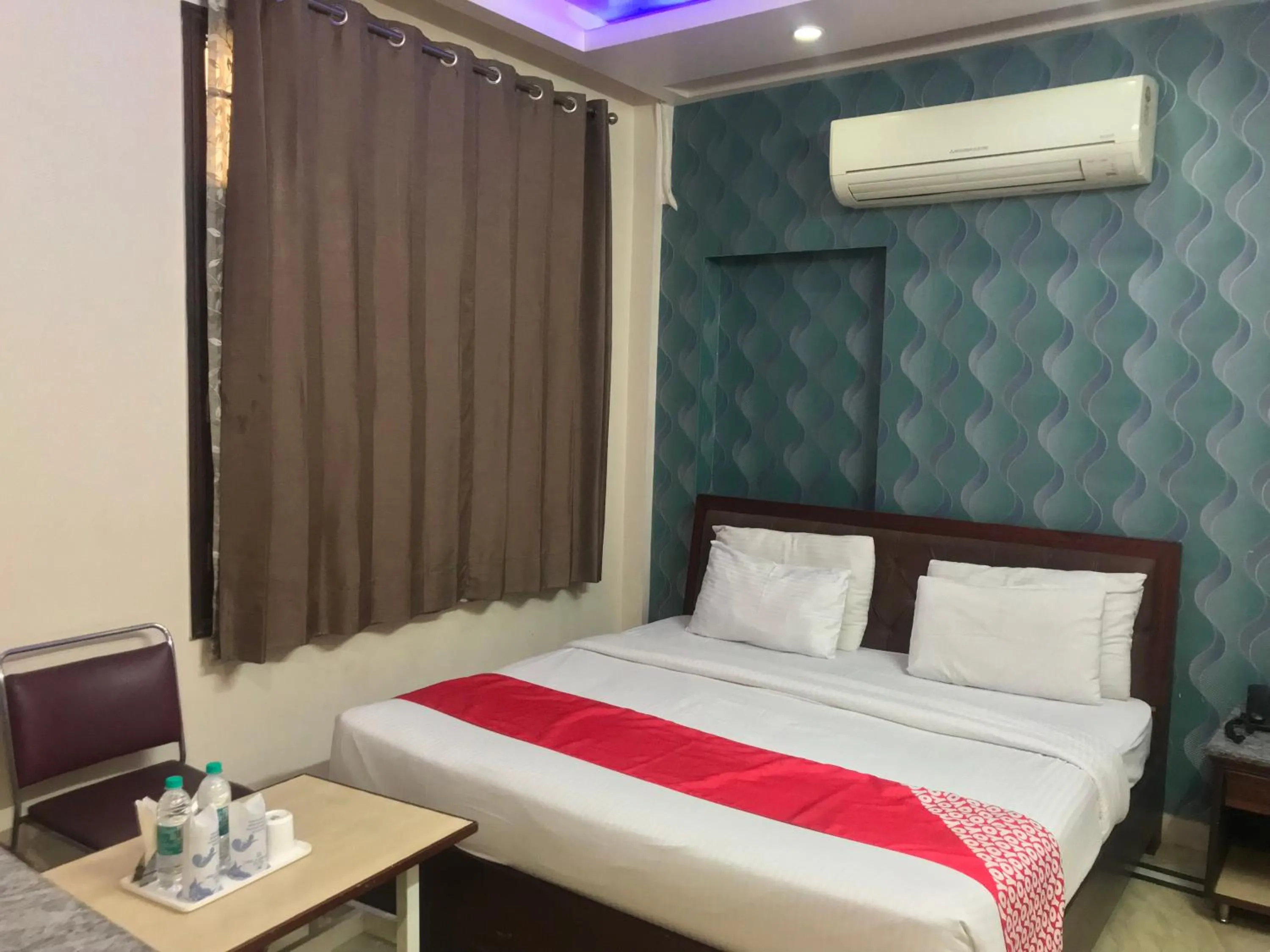 Photo of the whole room, Bed in Leela Residency