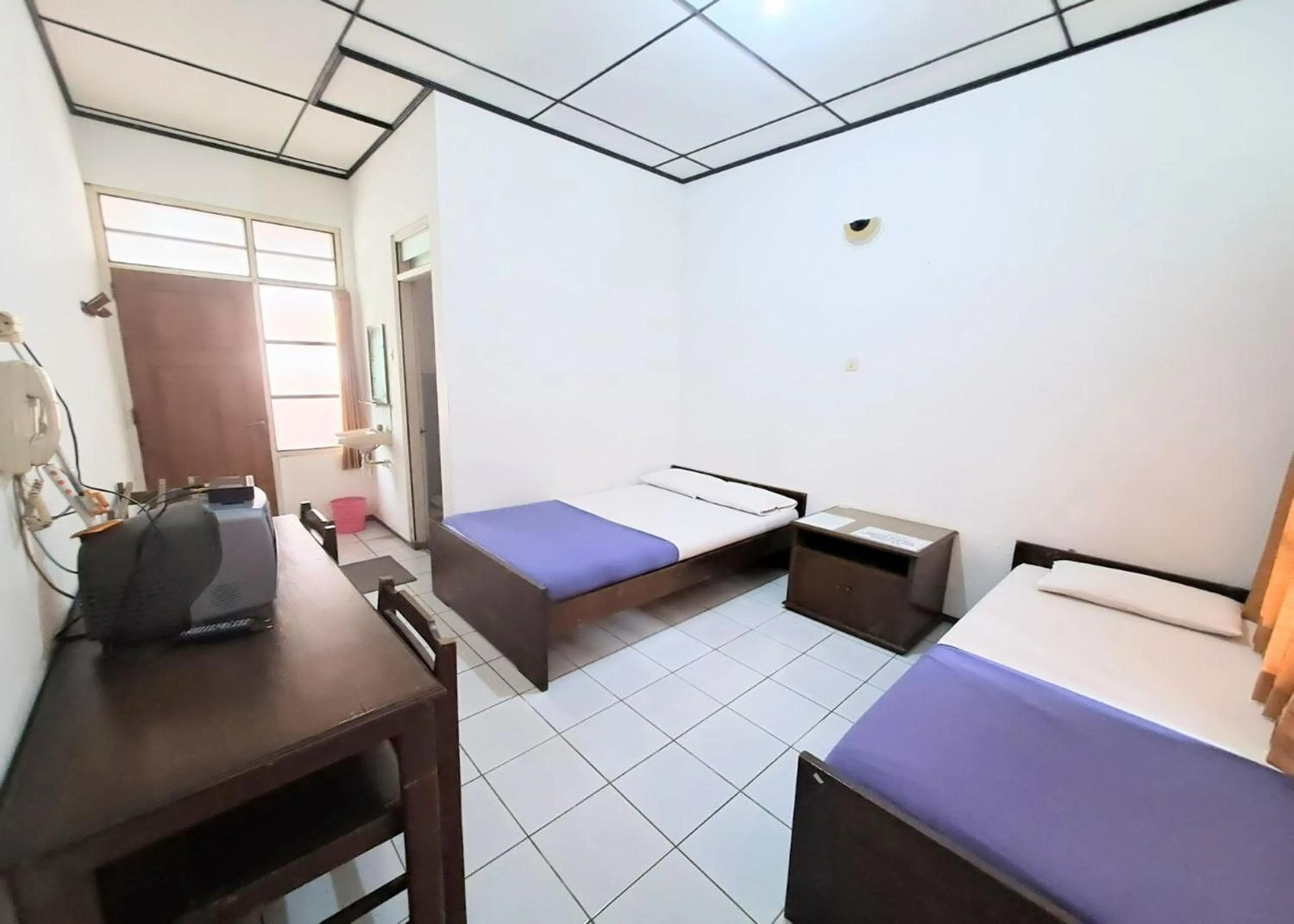 Bed in Satriafi Hotel