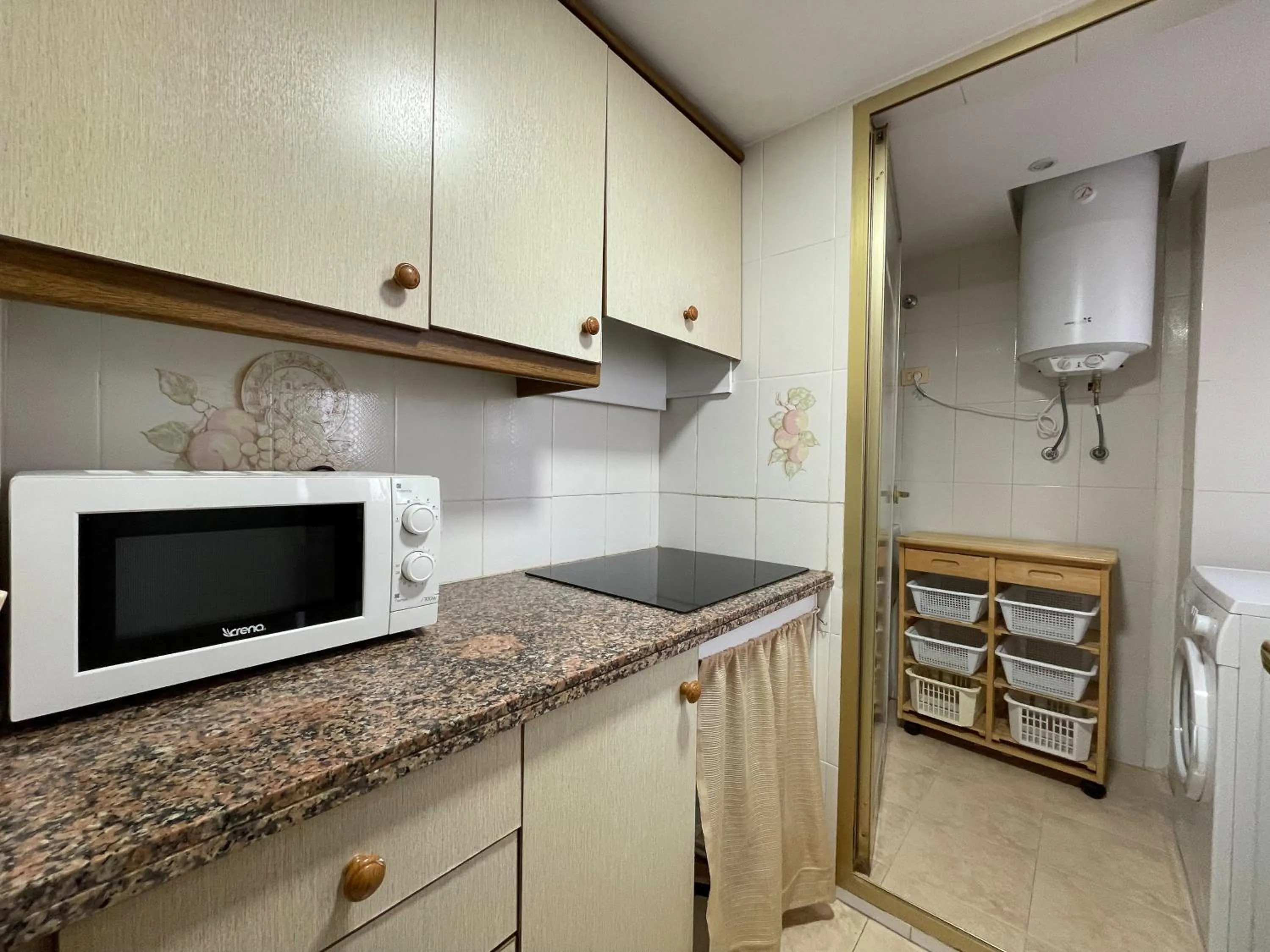 Kitchen or kitchenette in Apartamentos Neptuno Oropesa 3000
