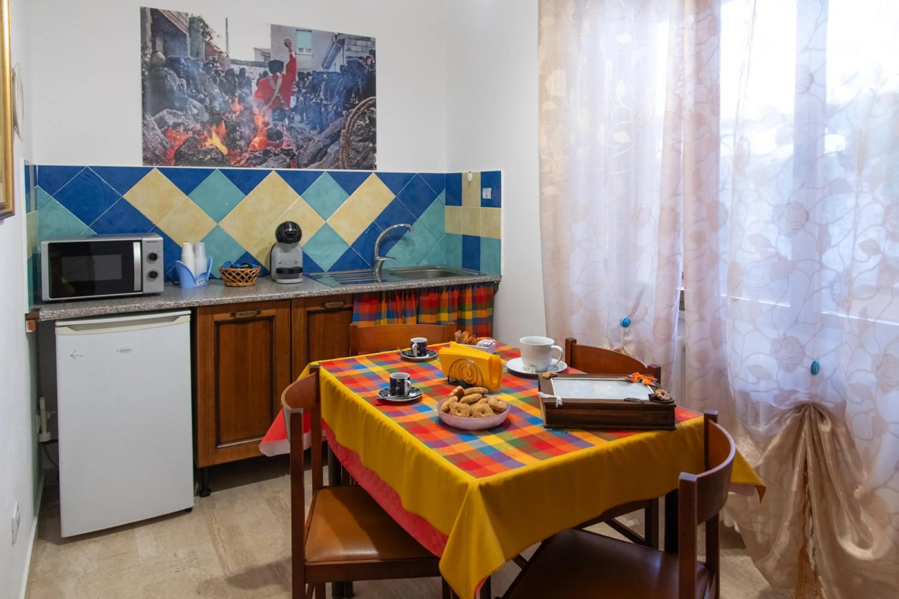 Kitchen or kitchenette in affittacamere S'Ortensia