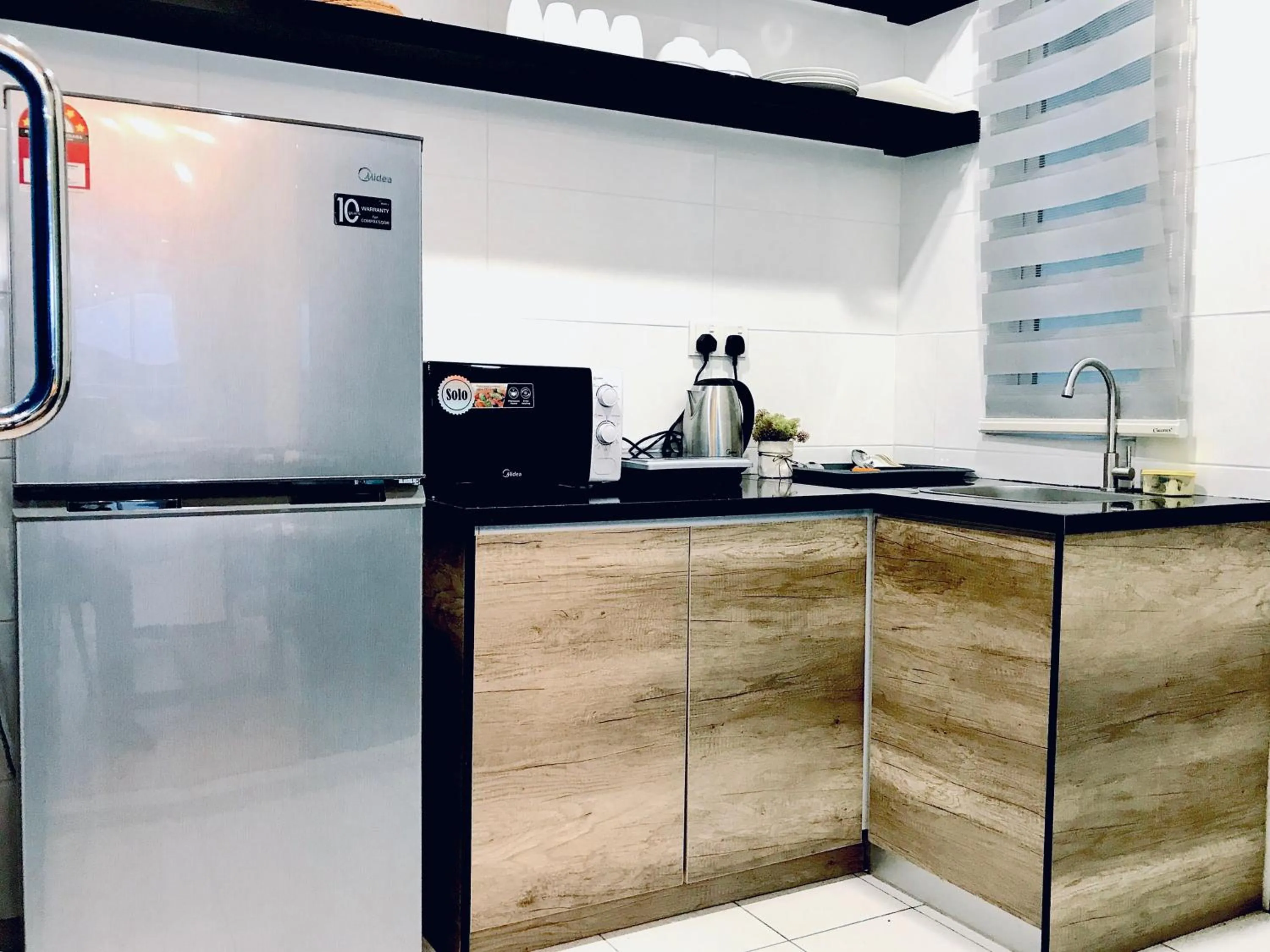 Communal kitchen in The Wave Suites Melaka