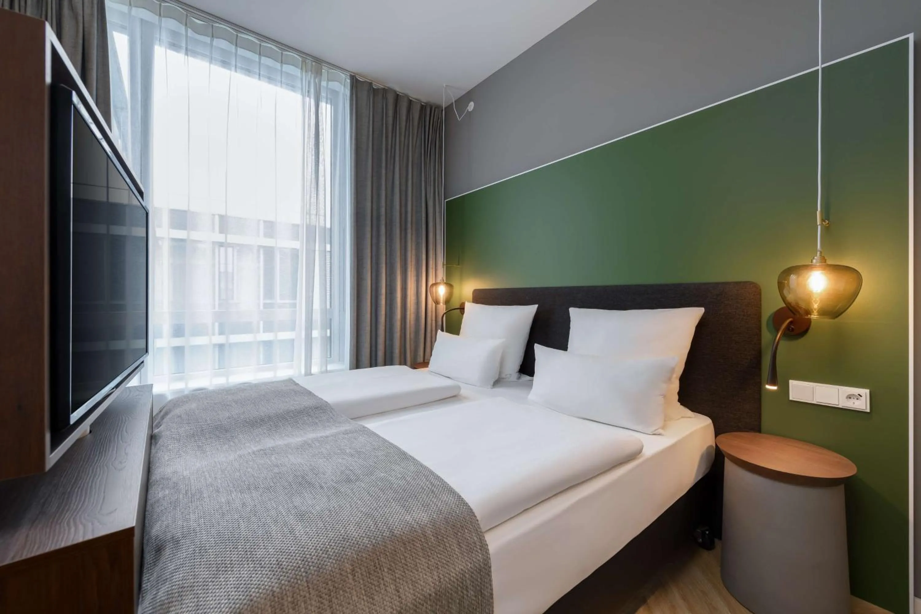 Bedroom, Bed in Flightgate Munich Airport Hotel, a member of Radisson Individuals
