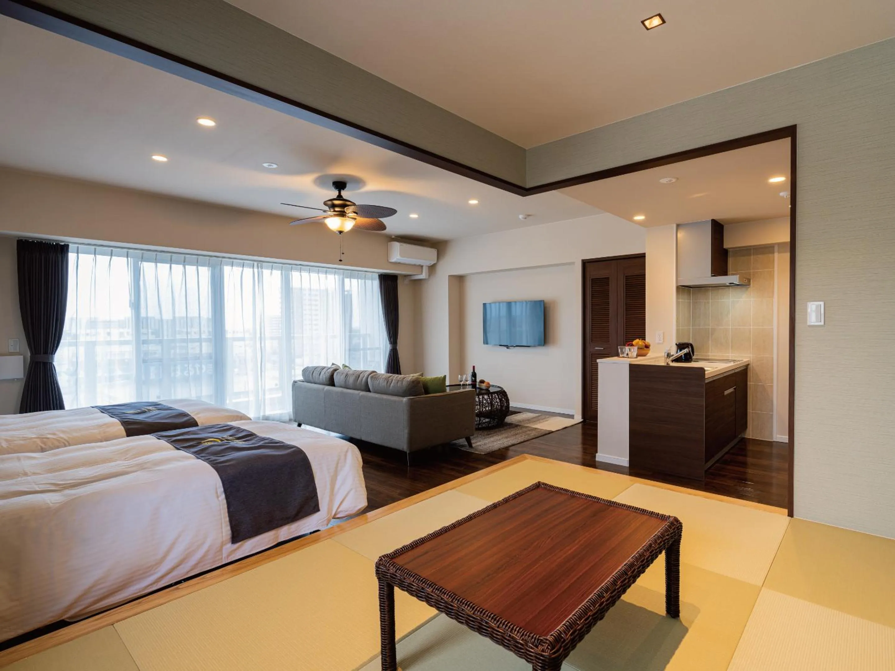 Living room, Bed in Aqua Palace Chatan by Coldio Premium