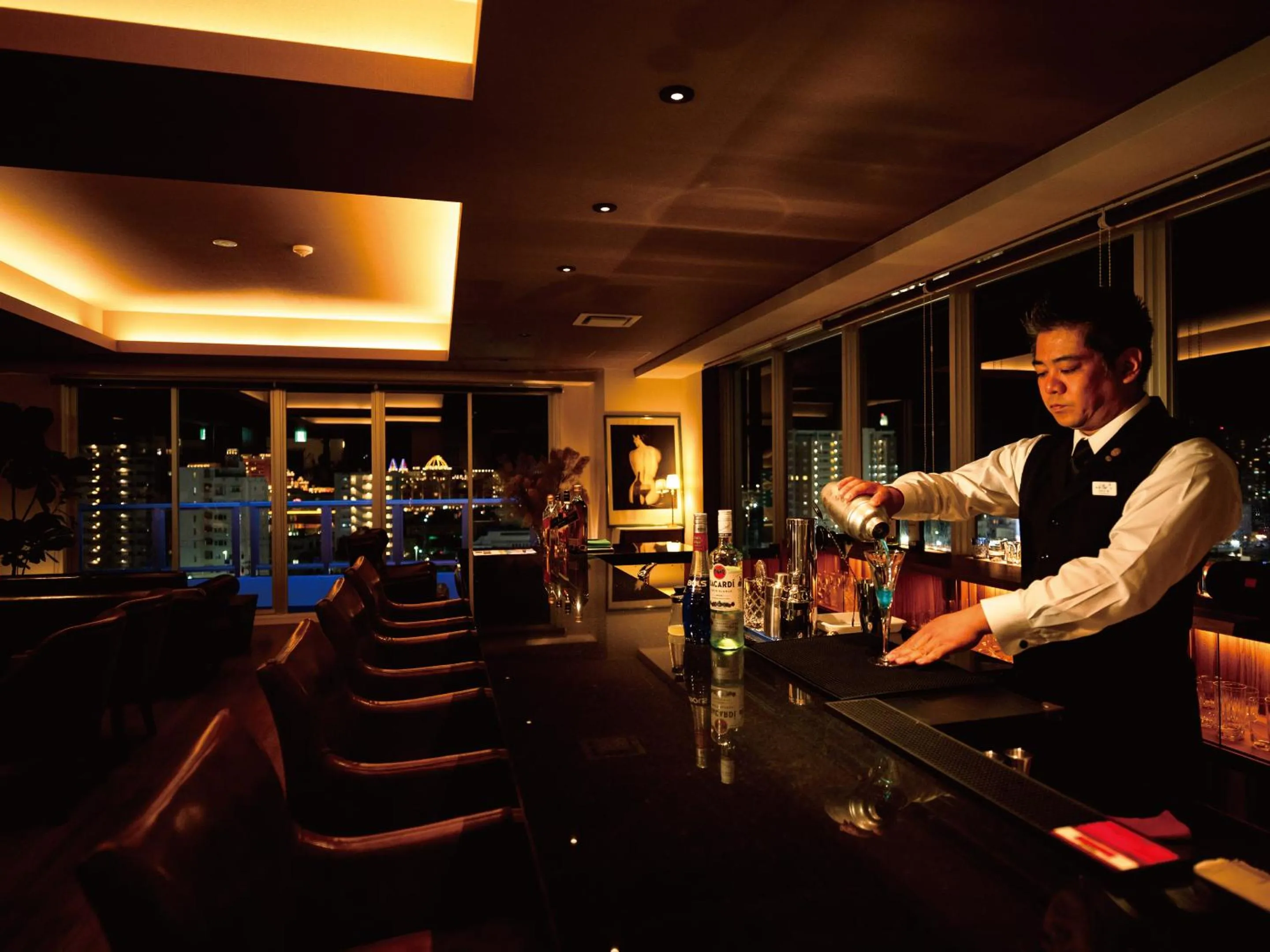 Lounge or bar in Aqua Palace Chatan by Coldio Premium