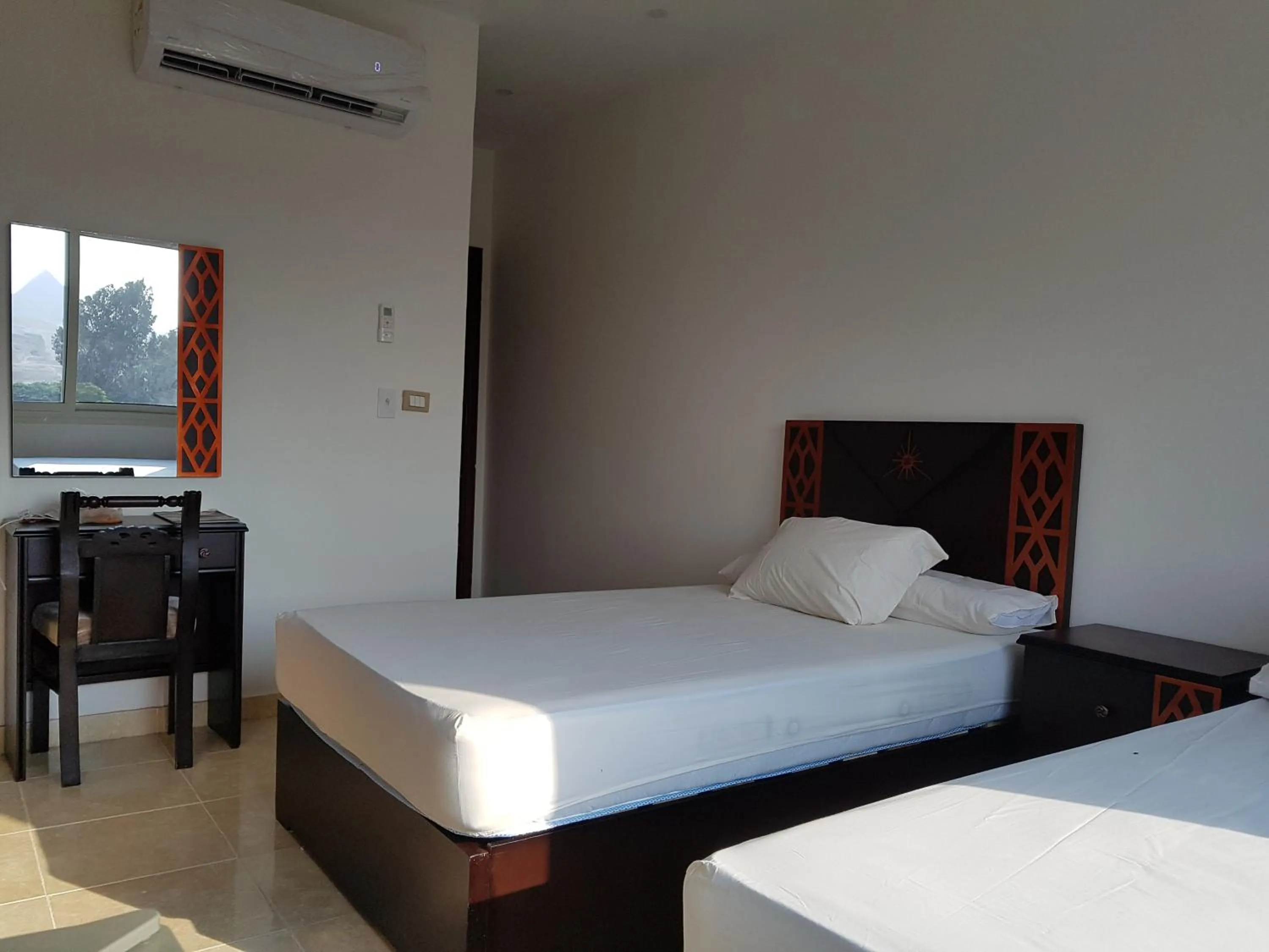 Bed in Sahara Pyramids Inn