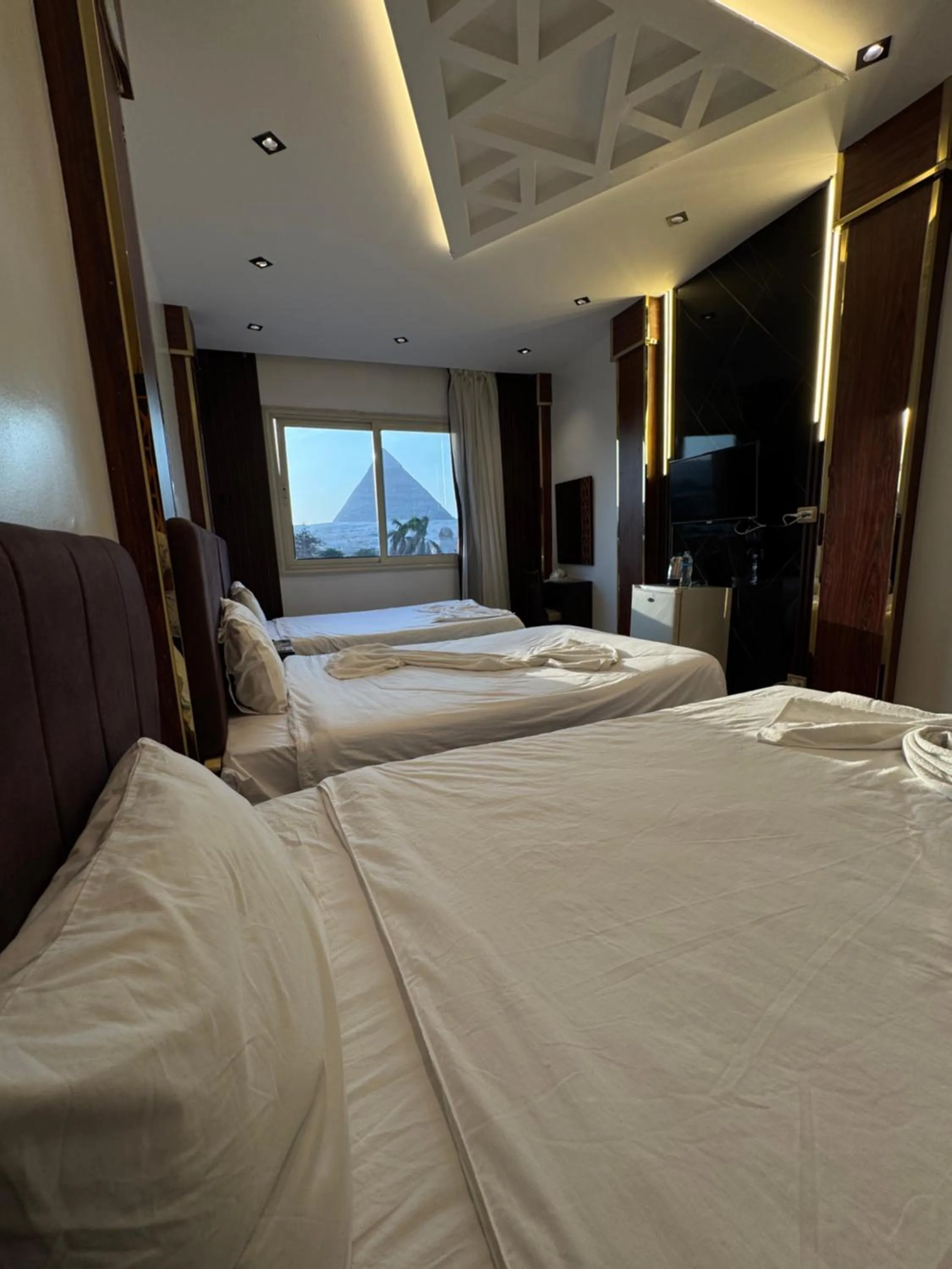 Bed in Sahara Pyramids Inn