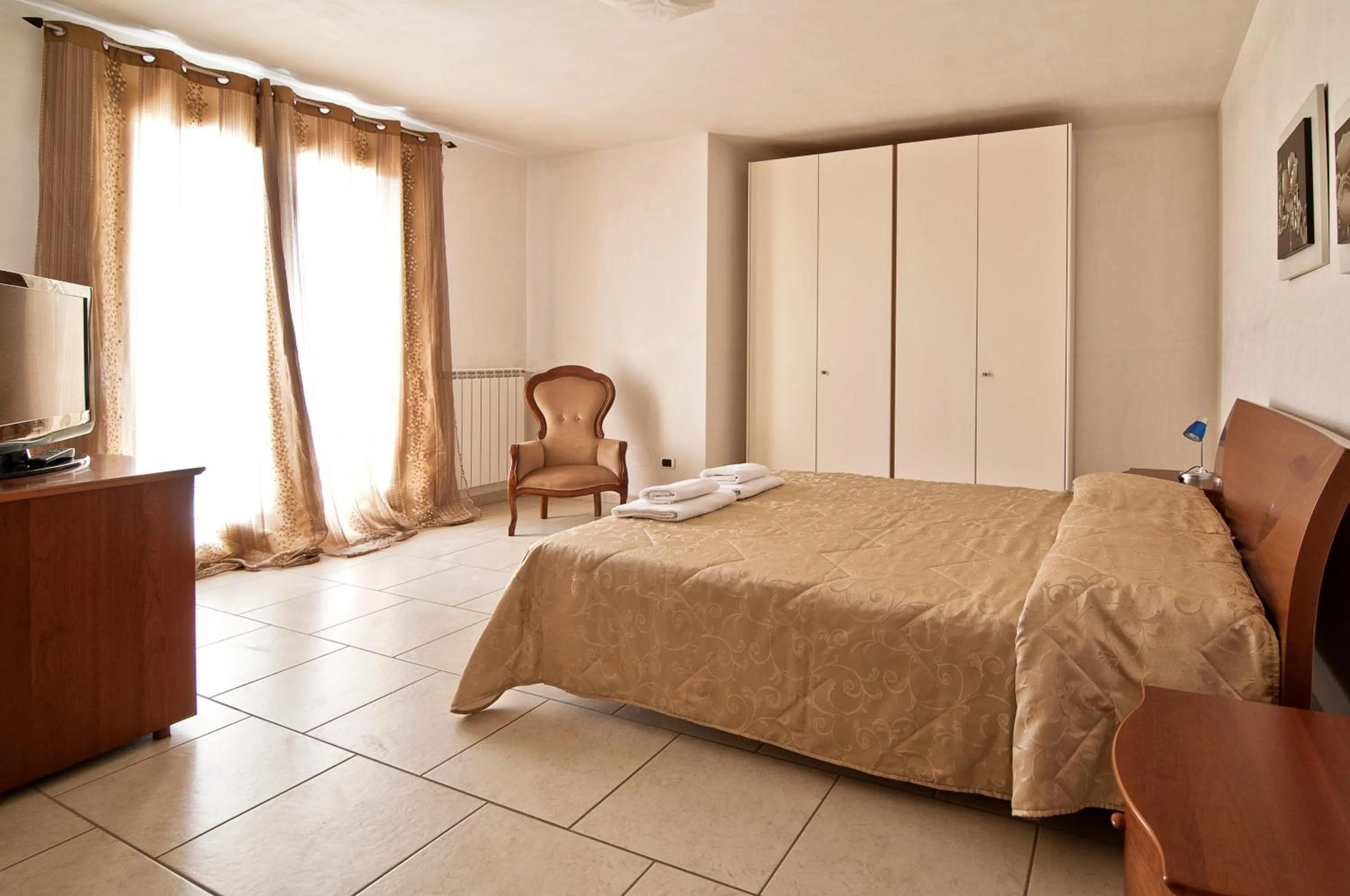 Bedroom in Giardino Dei Suoni B&B