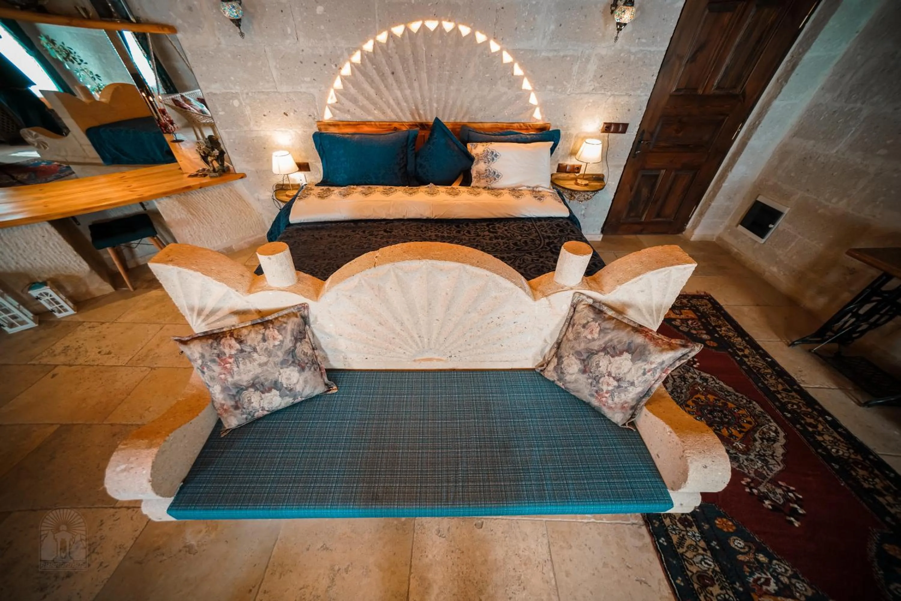 Bed in Zeus Cave Suites