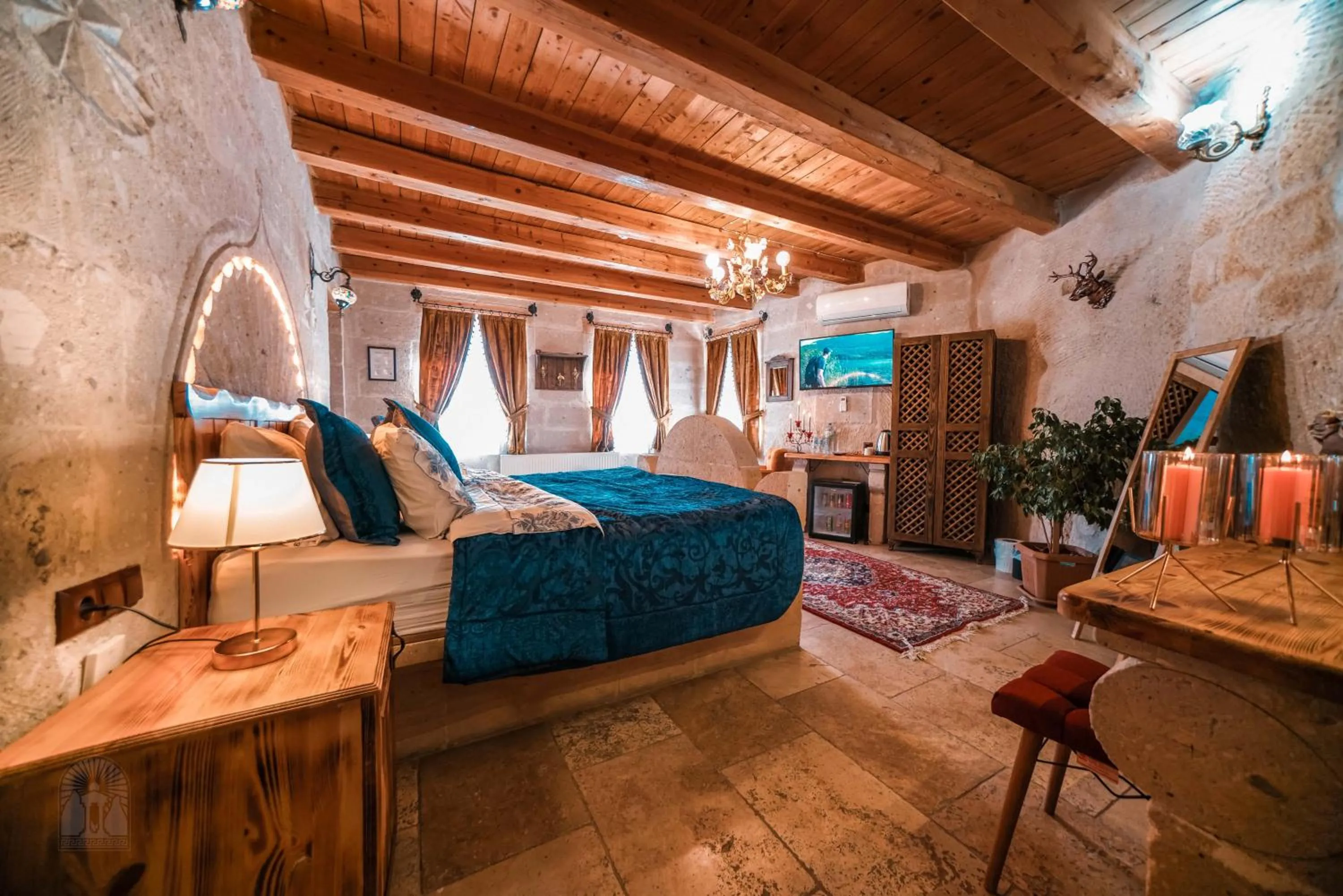 Bed in Zeus Cave Suites