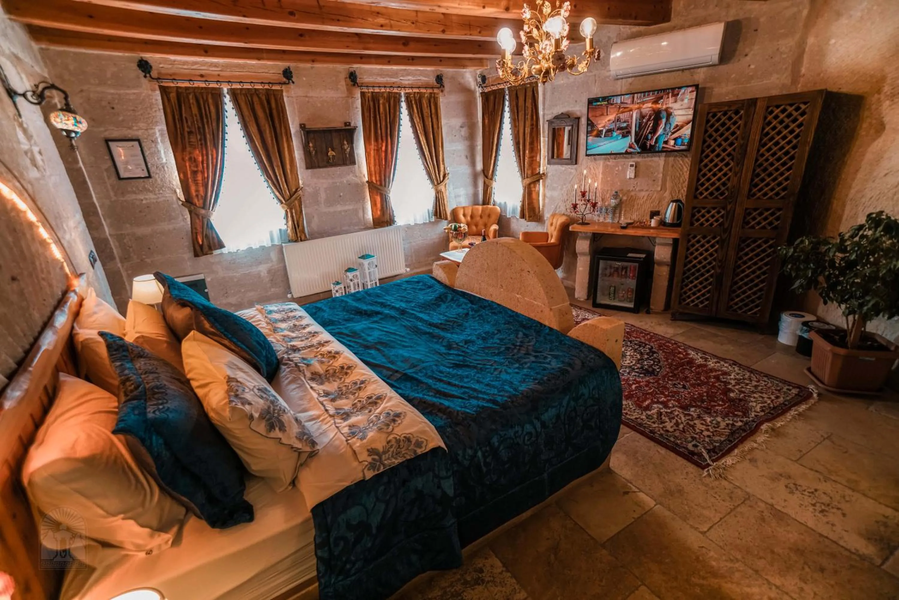 Bed in Zeus Cave Suites